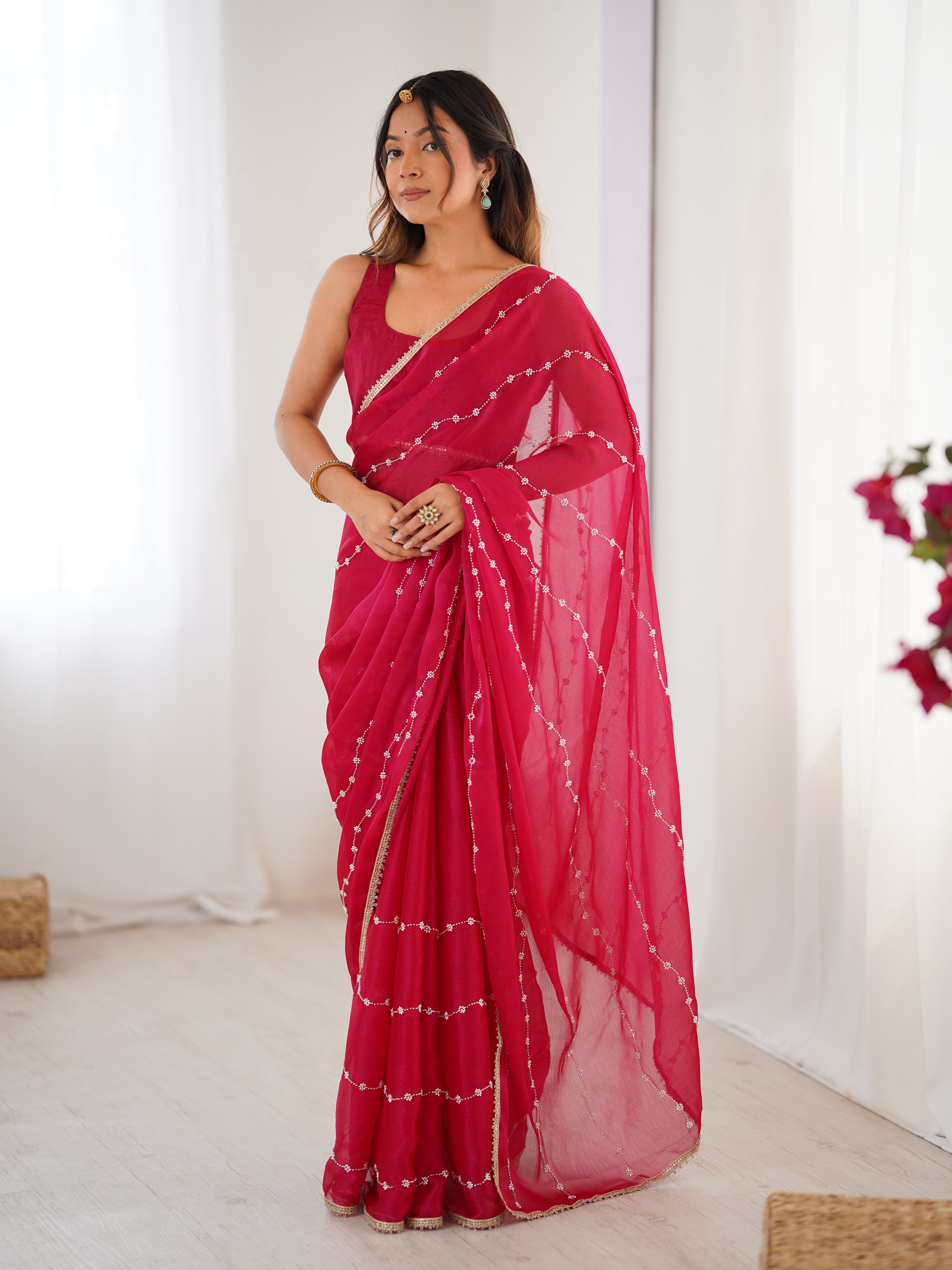 Back view of model in Pink Sitara Saree, showcasing pallu and full length.