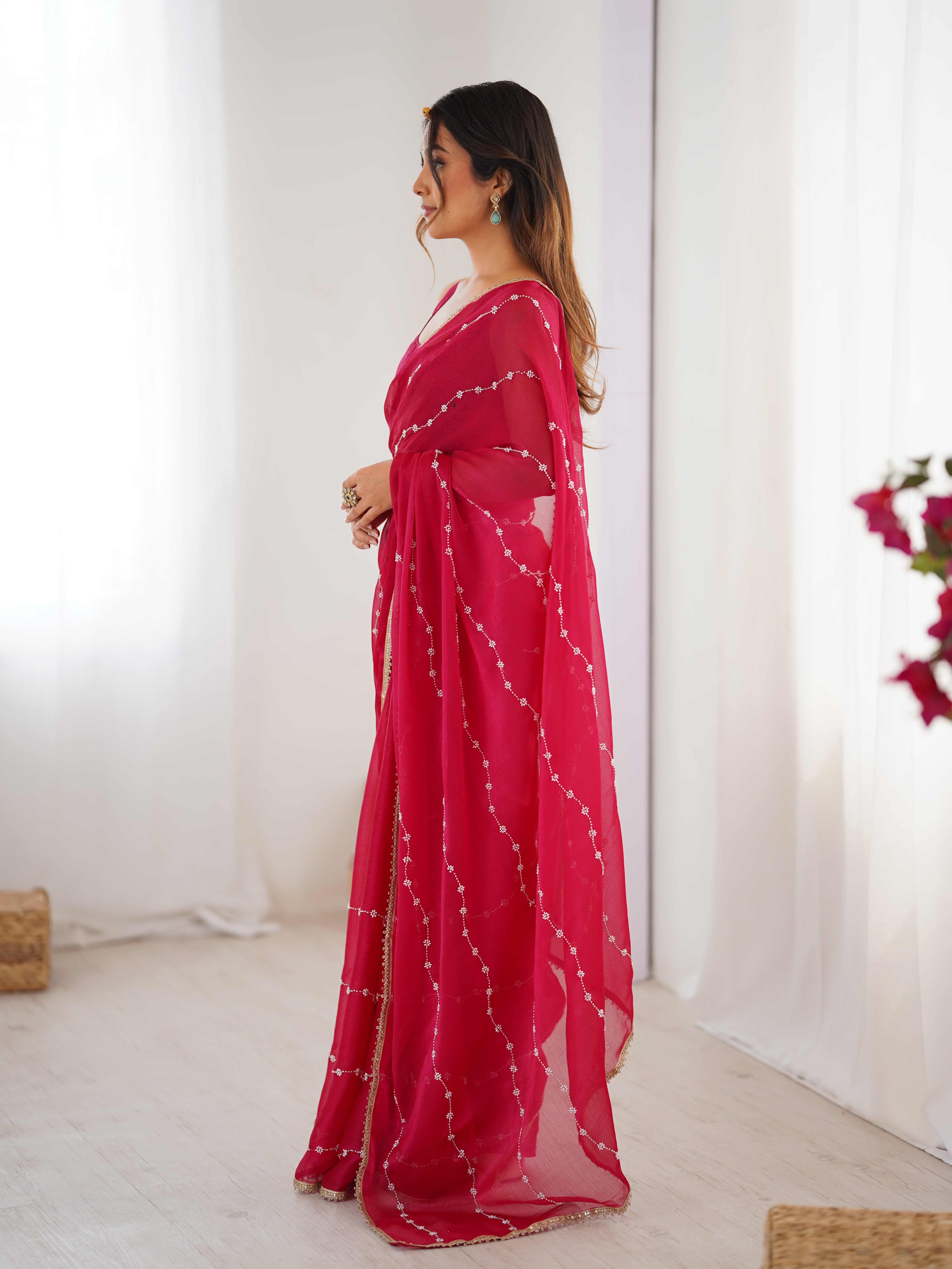 Detailed shot of Pink Sitara Saree's border and matching unstitched blouse with lace.