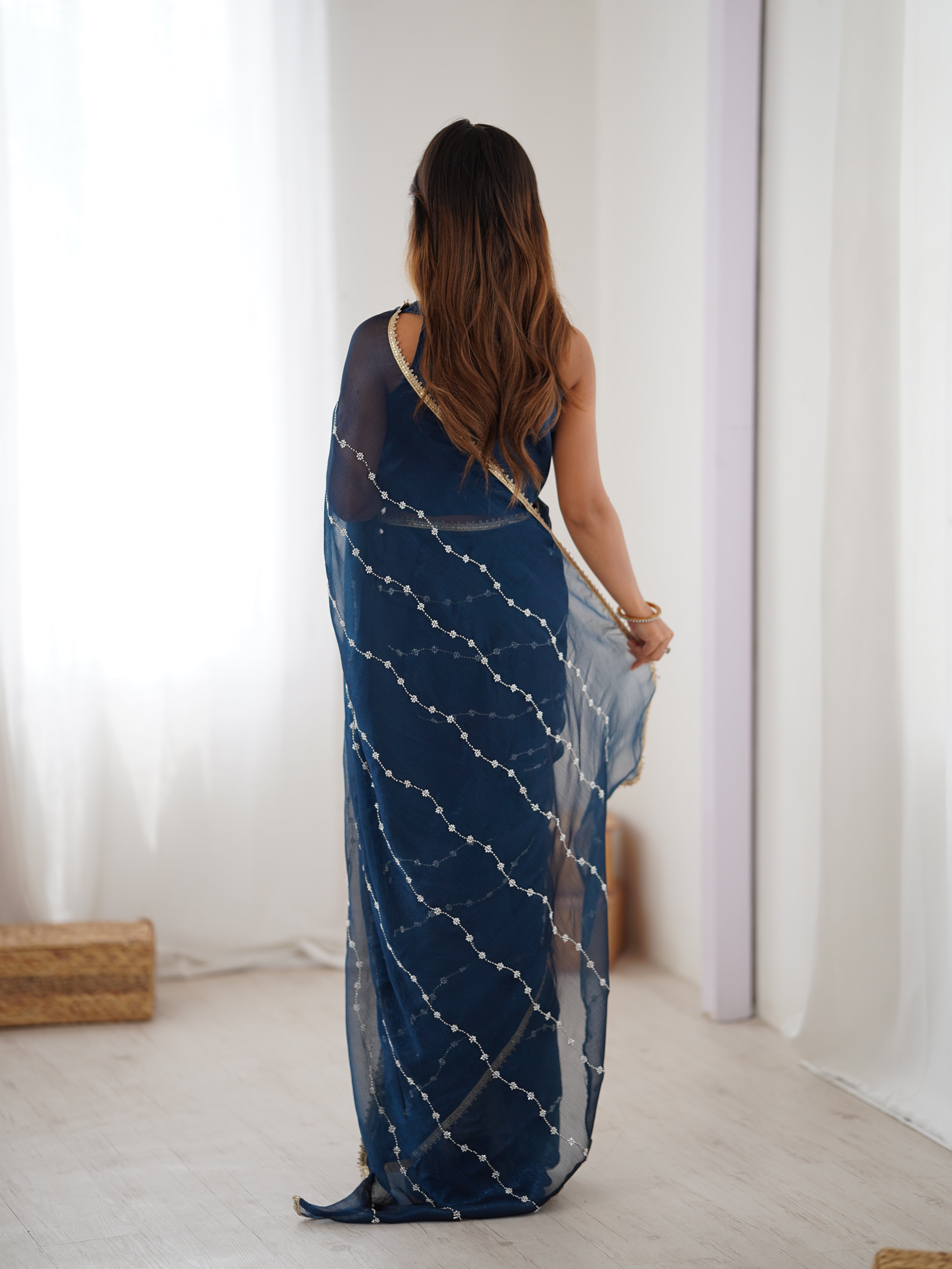Petrol Blue designer saree, close-up of intricate sequin and bead work on Sitara fabric.