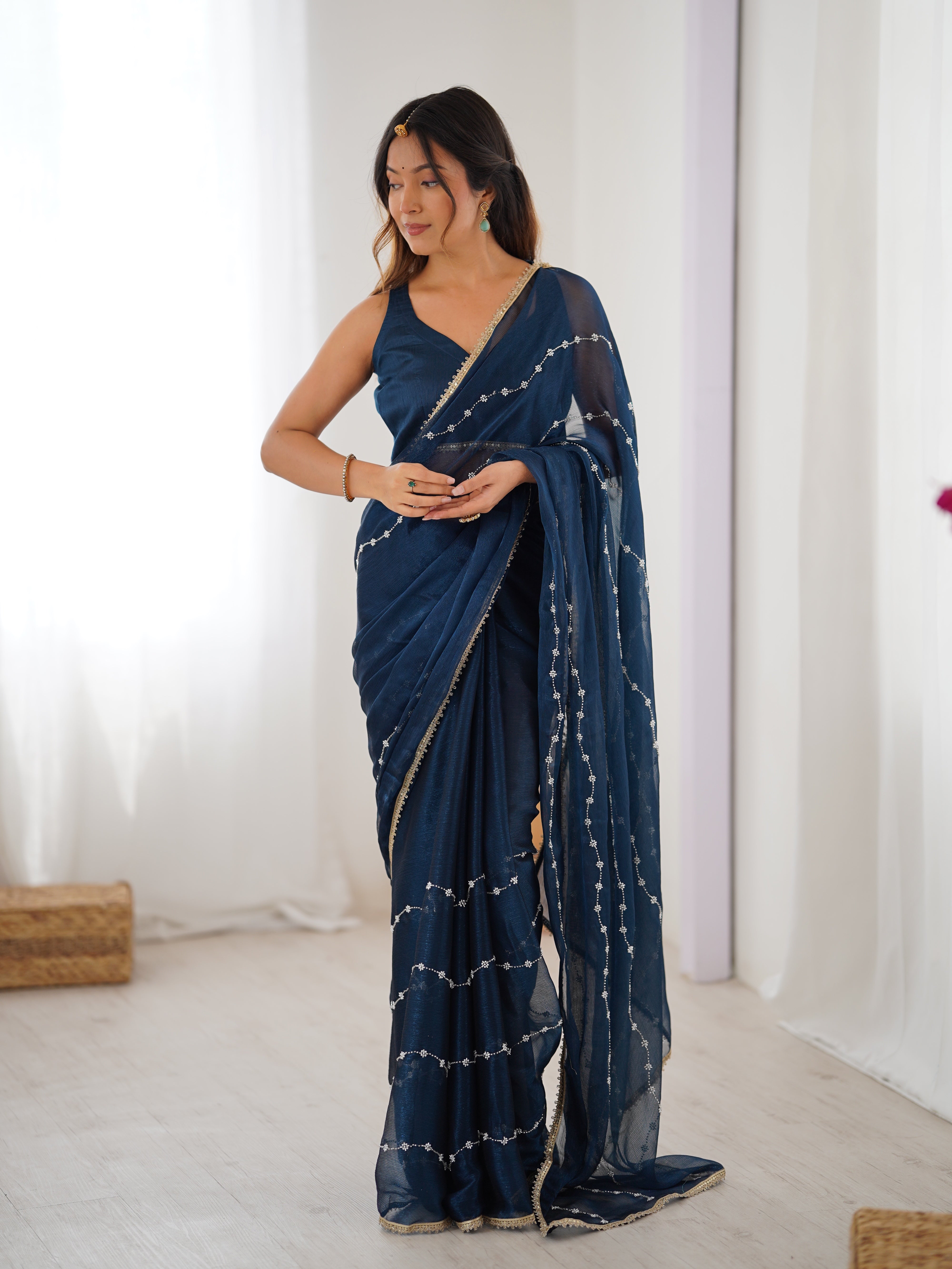 Graceful movement of Petrol Blue Sitara Saree, with flowing pallu and shimmering sequin design.