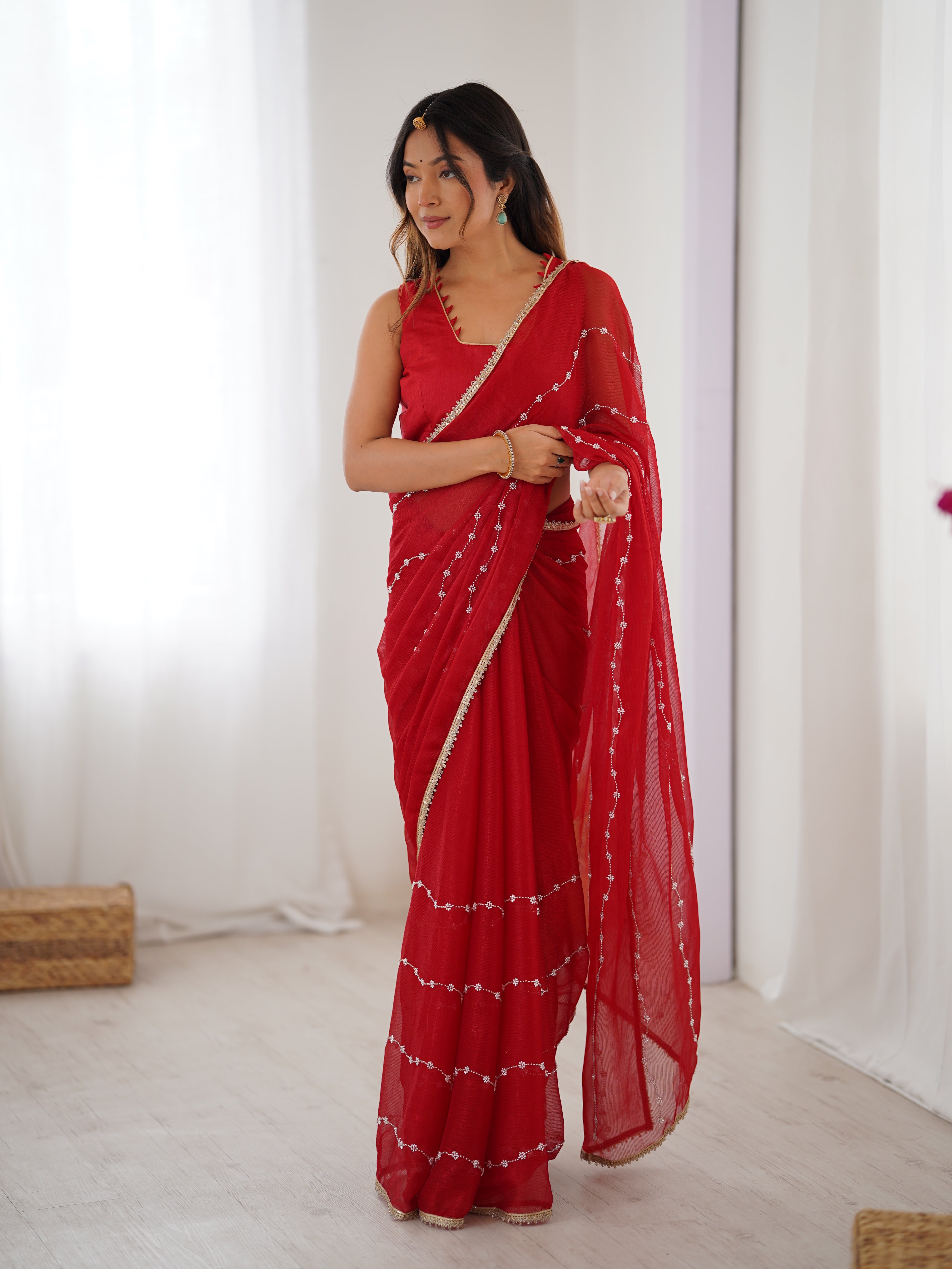 Graceful movement of Red Sitara Saree, with flowing pallu and shimmering sequin design.