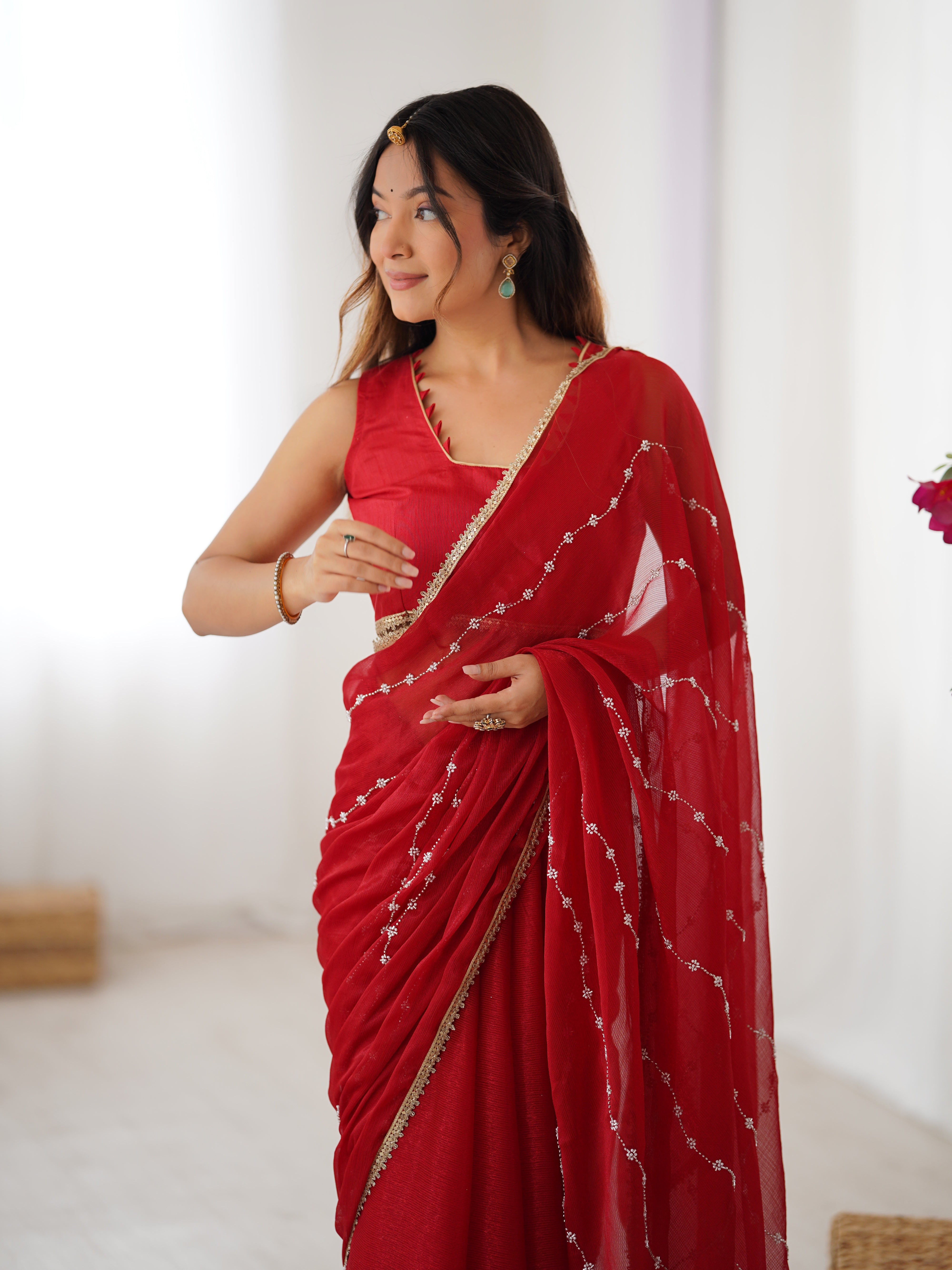 Full length studio shot of model in Red Sitara Fabric Saree, showcasing overall style.