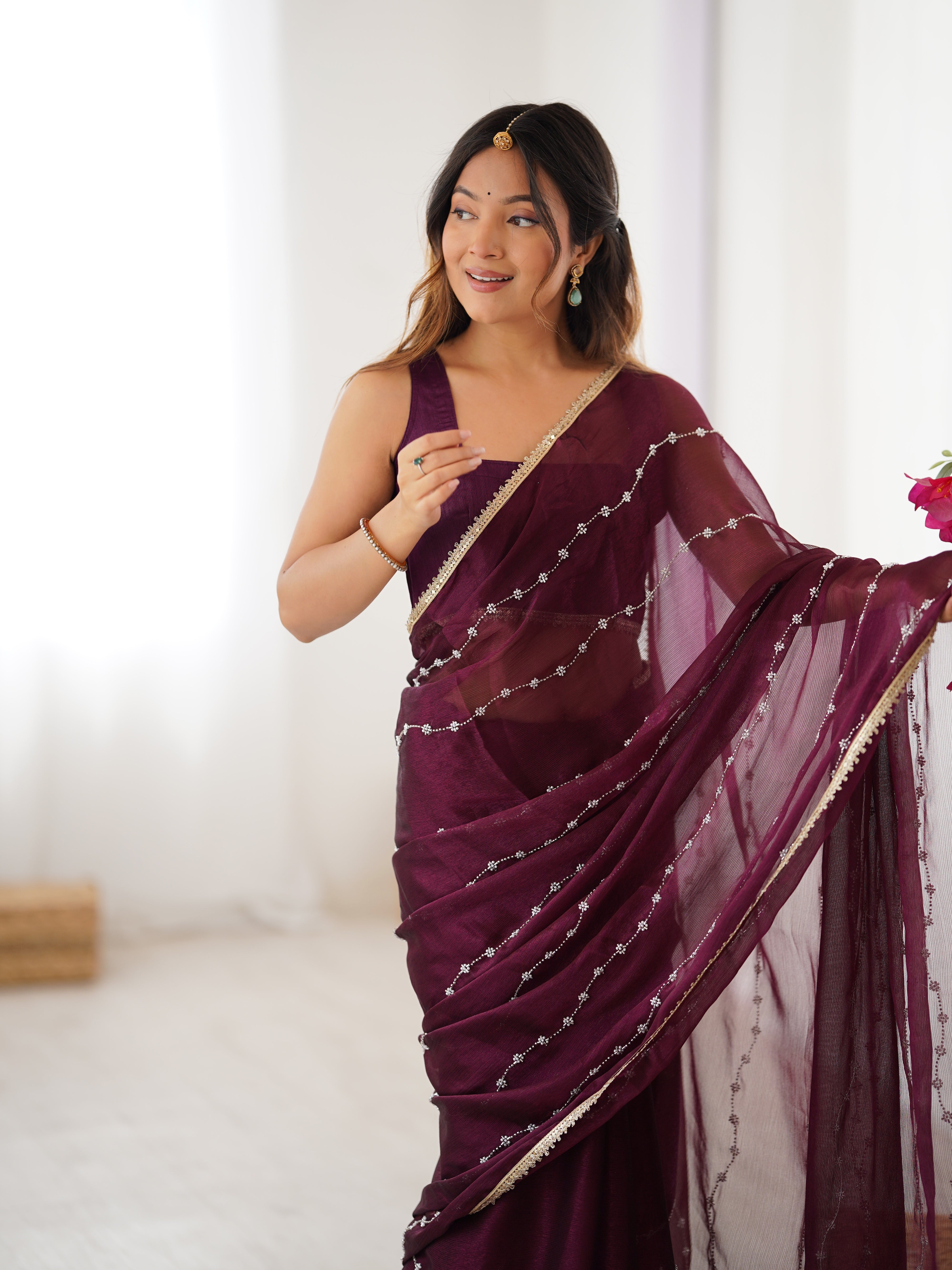 Model in Wine Sitara Saree, side profile showing graceful drape and bead work.