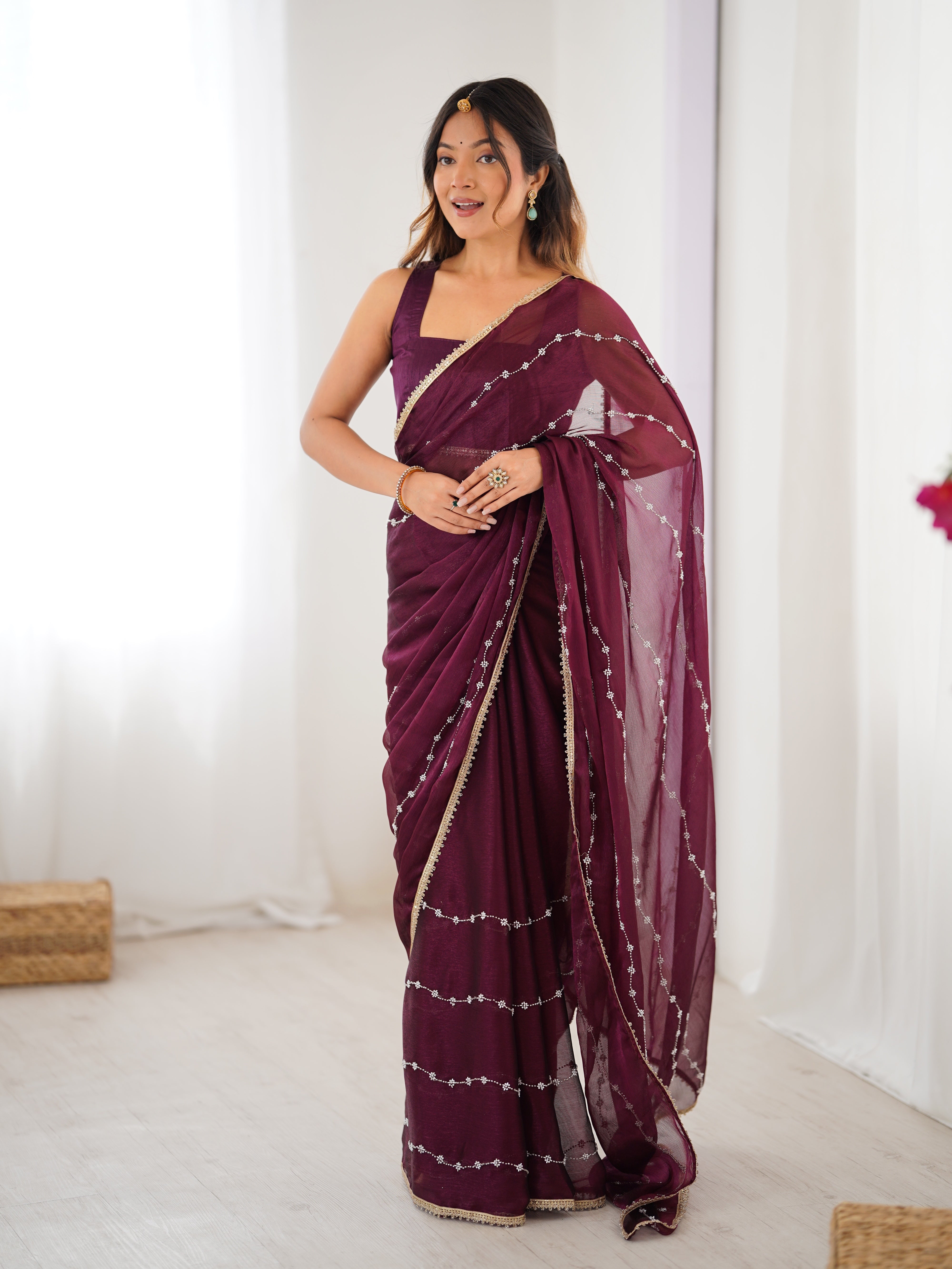 Back view of model in Wine Sitara Saree, showcasing pallu and full length.