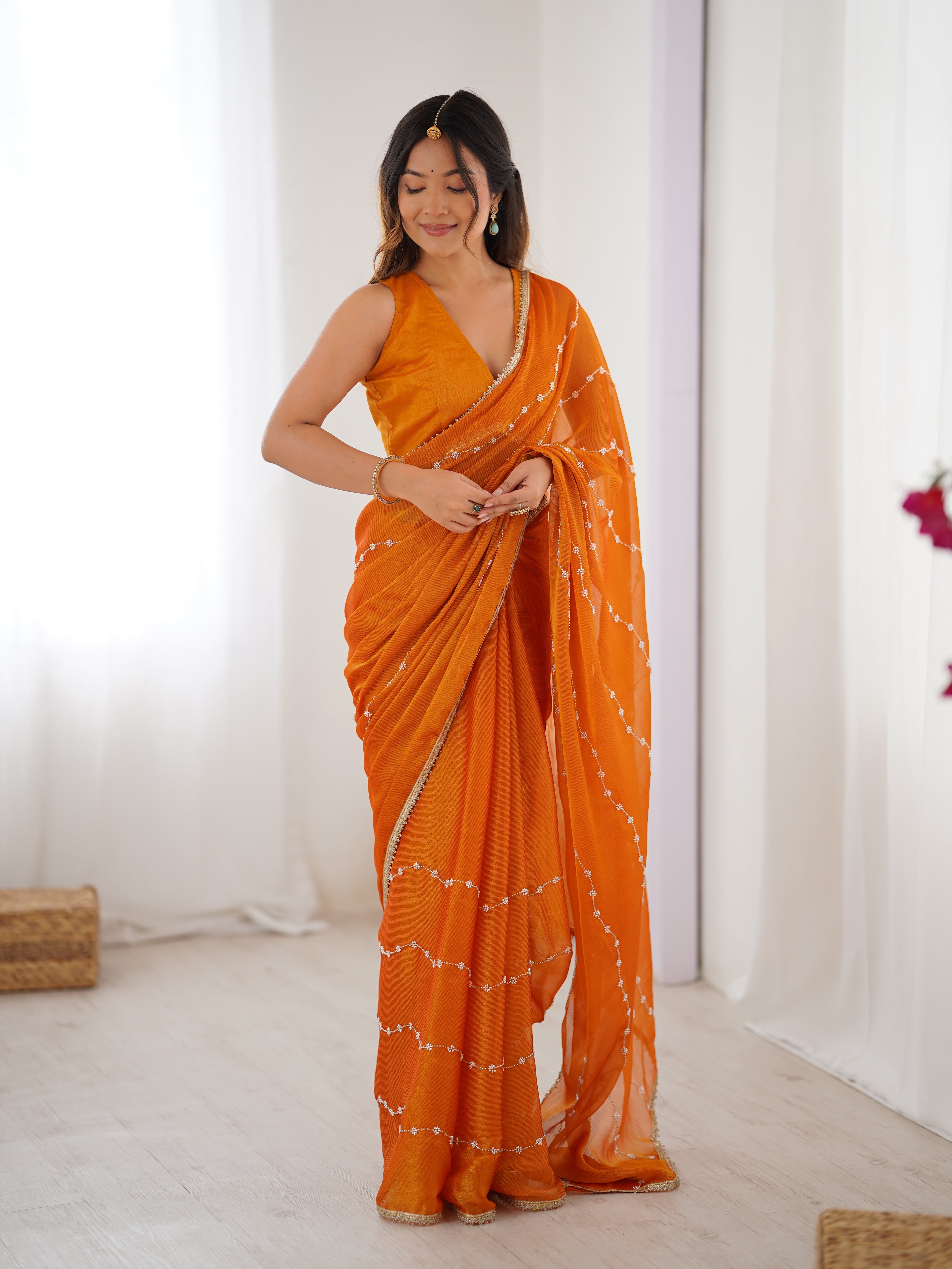 Model in Yellow Sitara Saree, side profile showing graceful drape and bead work.