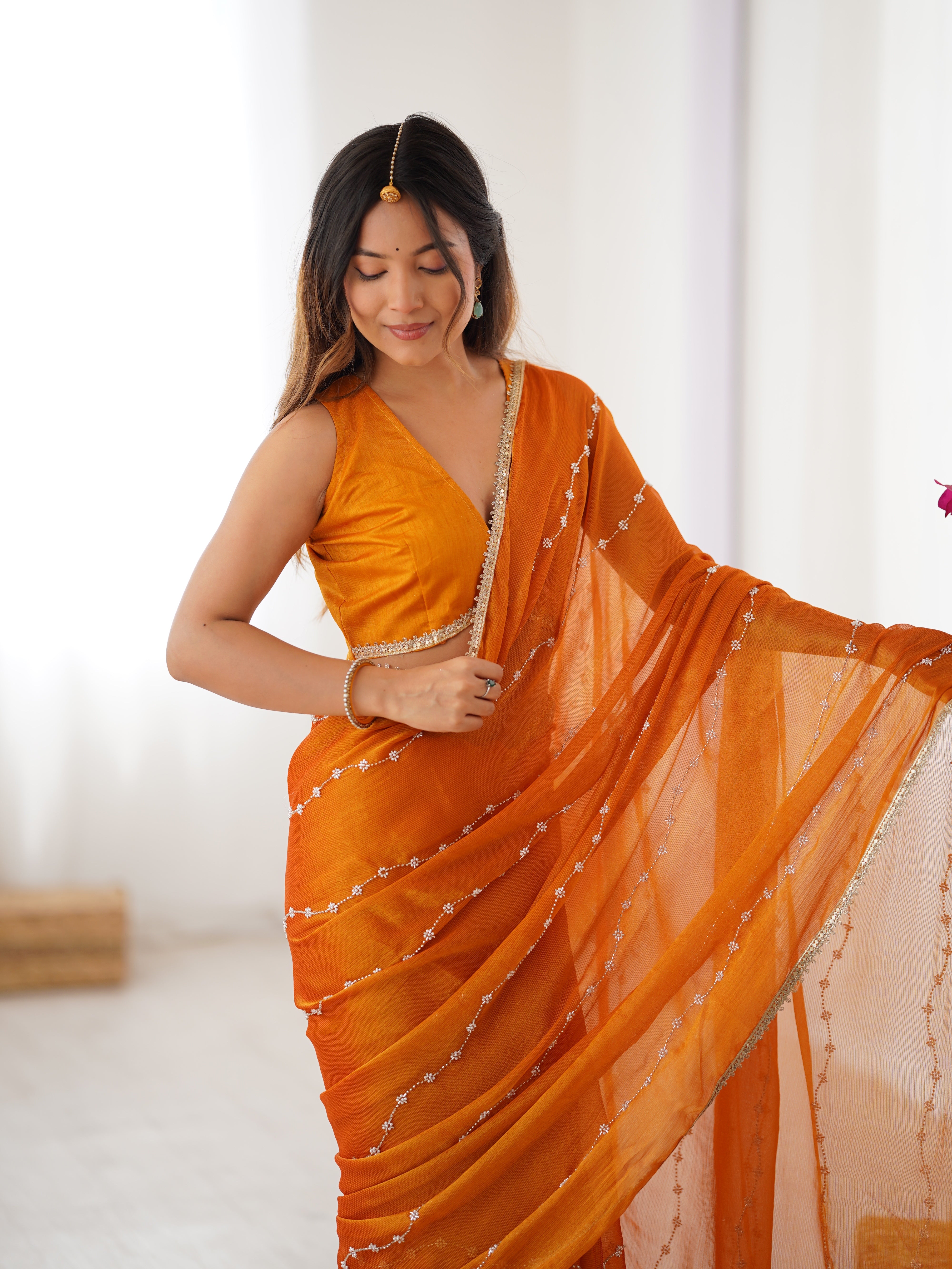 Back view of model in Yellow Sitara Saree, showcasing pallu and full length.