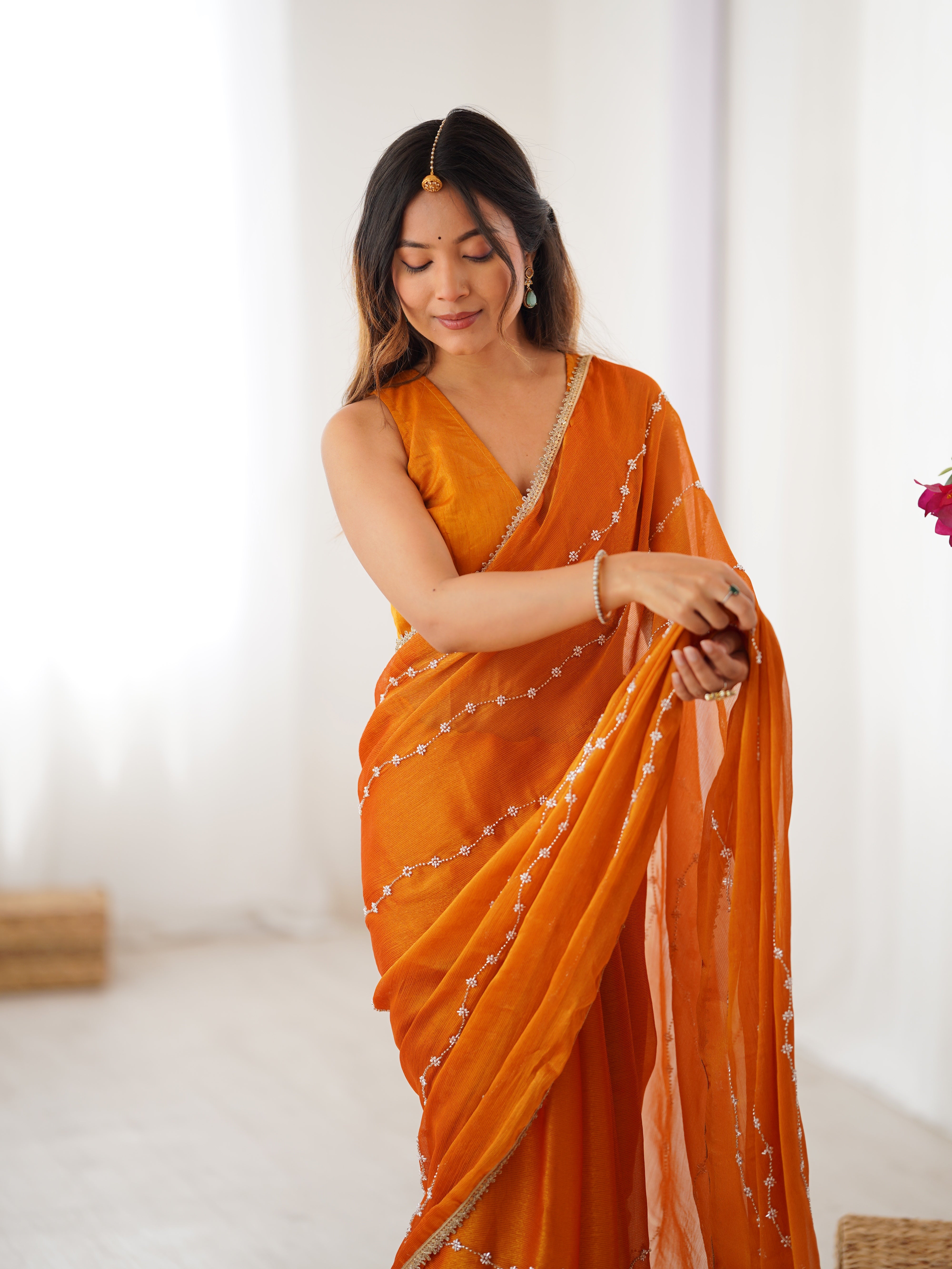 Model posing confidently in Yellow Sitara Fabric Saree, highlighting embellishments.