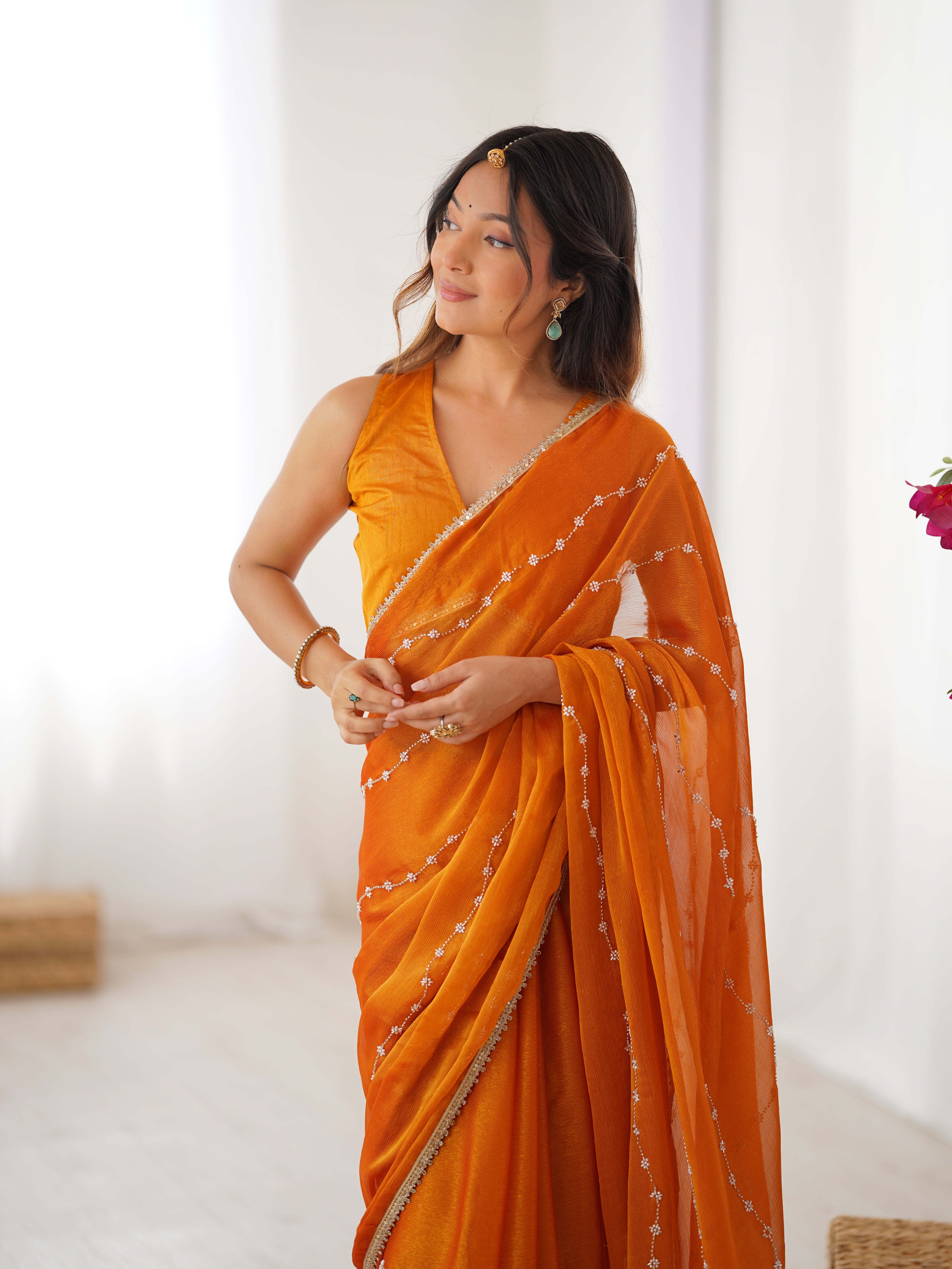 Detailed shot of Yellow Sitara Saree's border and matching unstitched blouse with lace.