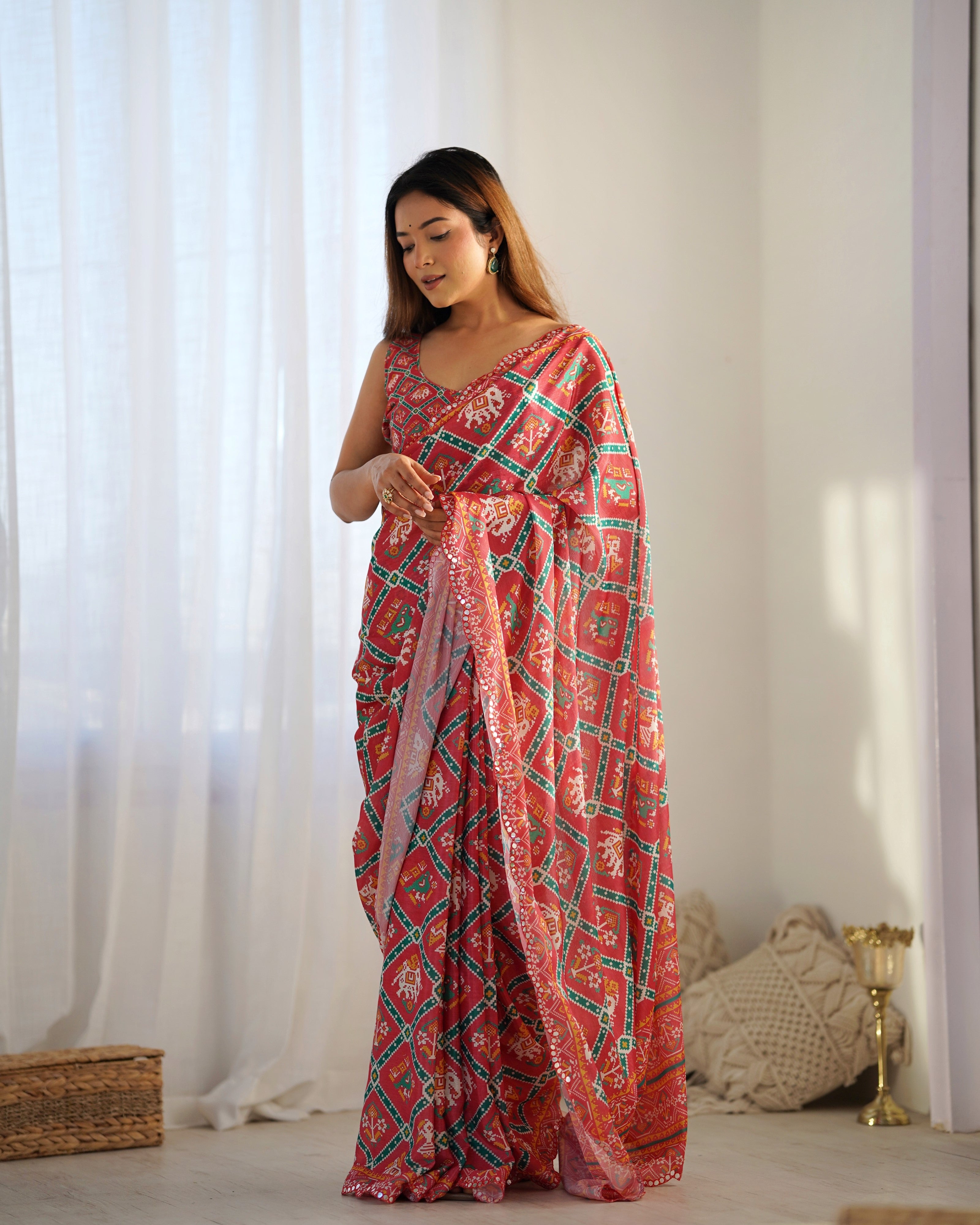 TRENDBUY Heavy Chinnon Saree with intricate Kutchi Mirror Work border and unstitched blouse.