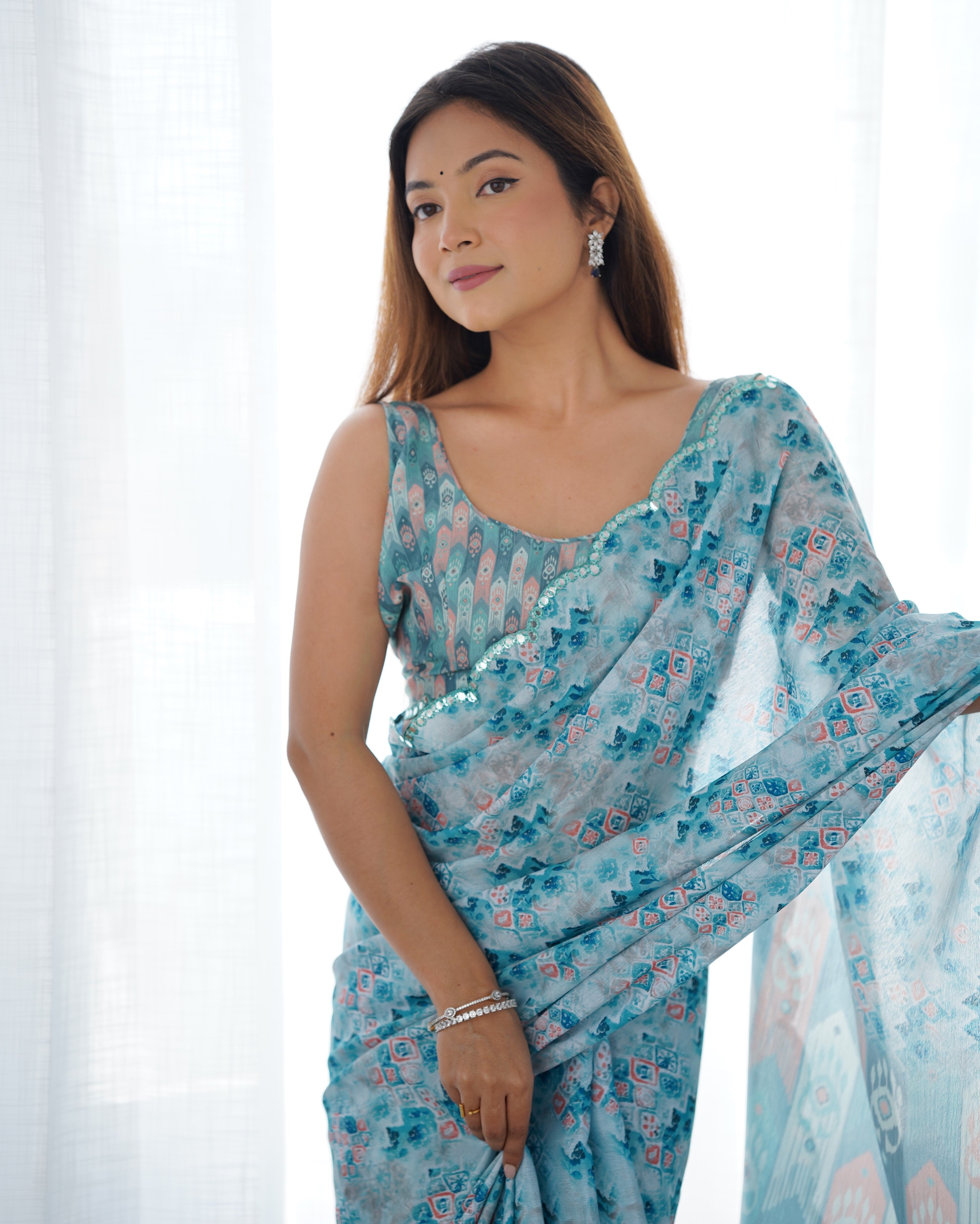 Heavy Chinnon Saree with elegant print & Kutchi mirror lace border