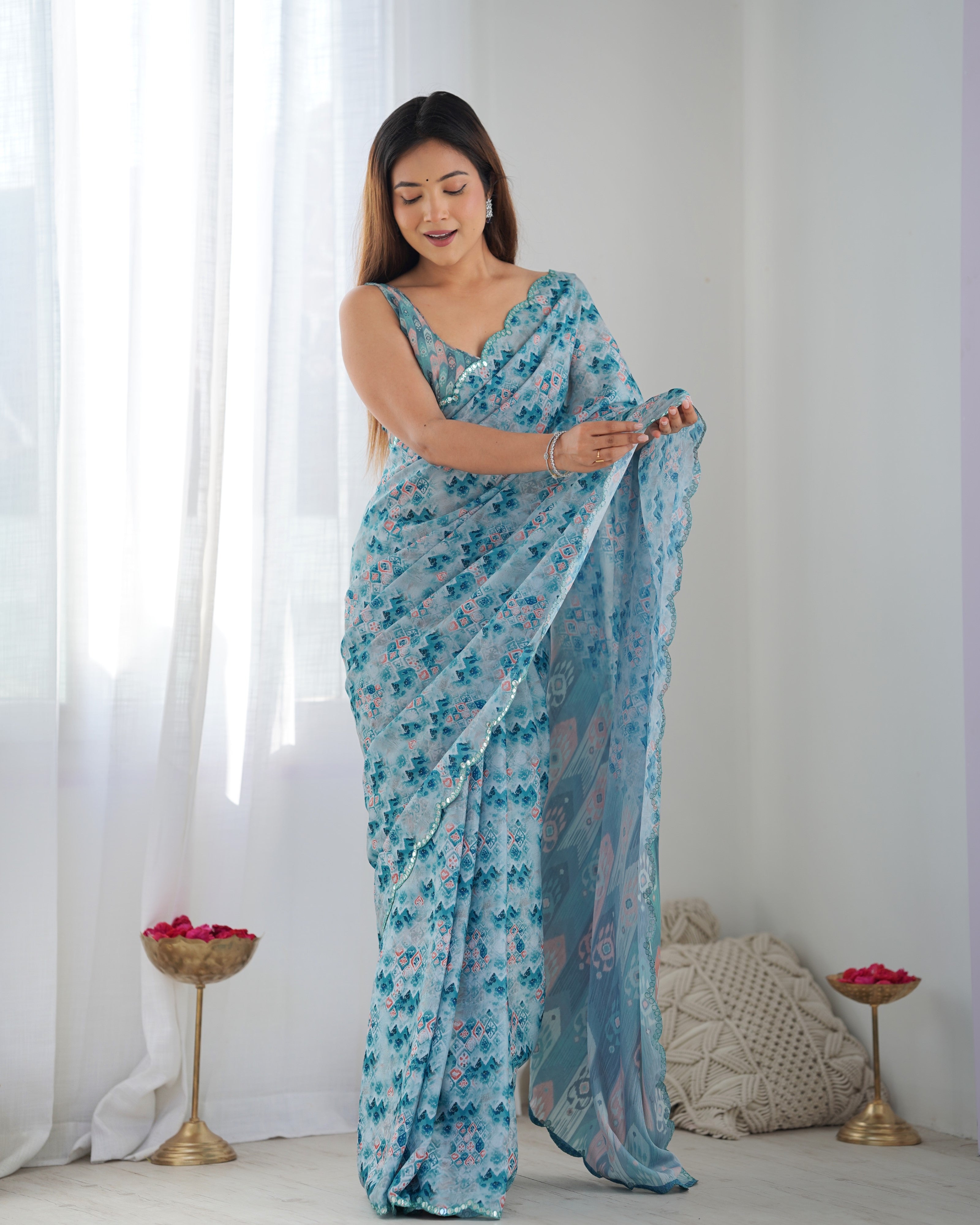 Elegant printed heavy Chinnon saree with Kutchi mirror lace border & unstitched blouse.
