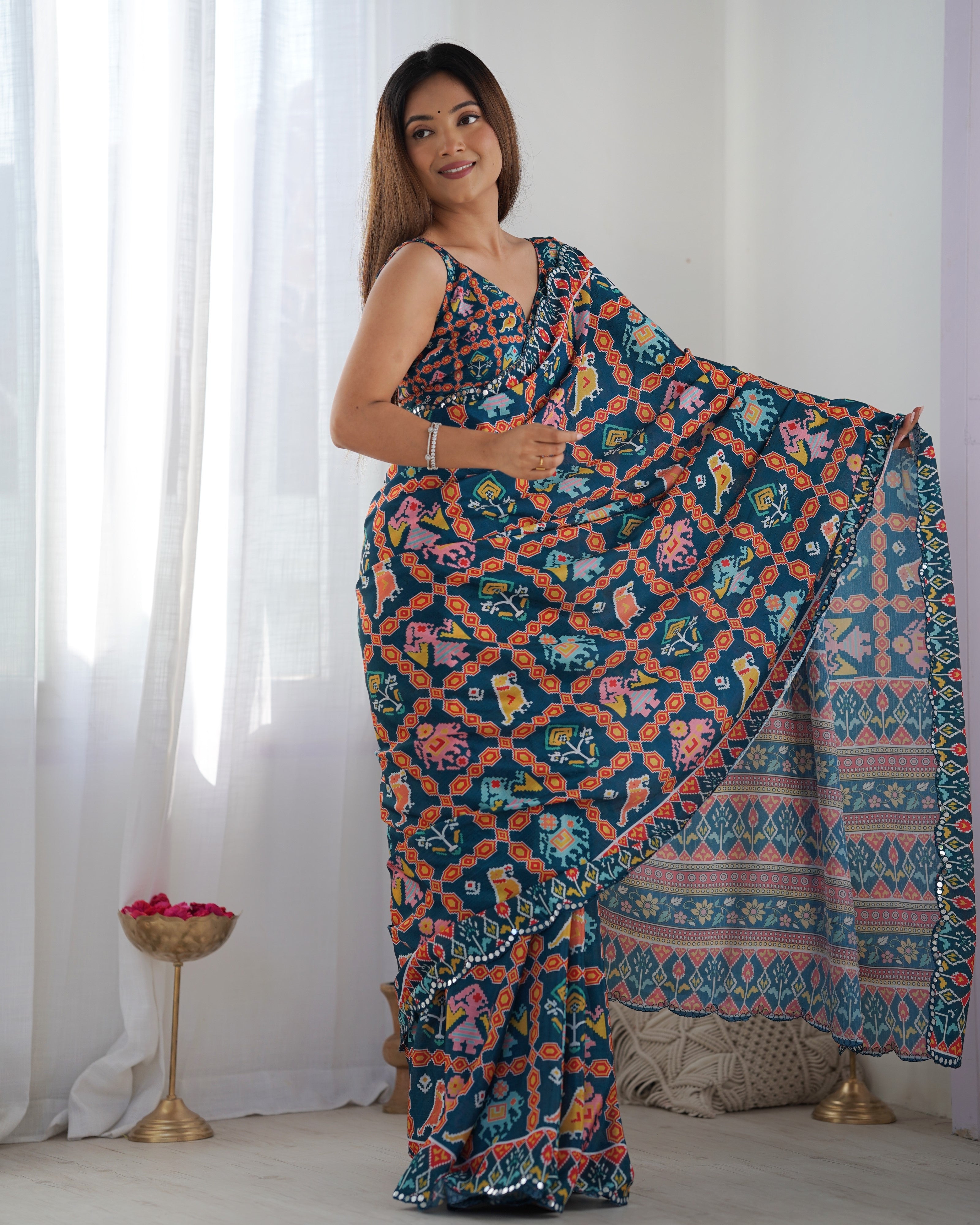 TRENDBUY DVS-12 Heavy Chinnon Saree: Vibrant print with intricate Kutchi mirror work lace border detail.
