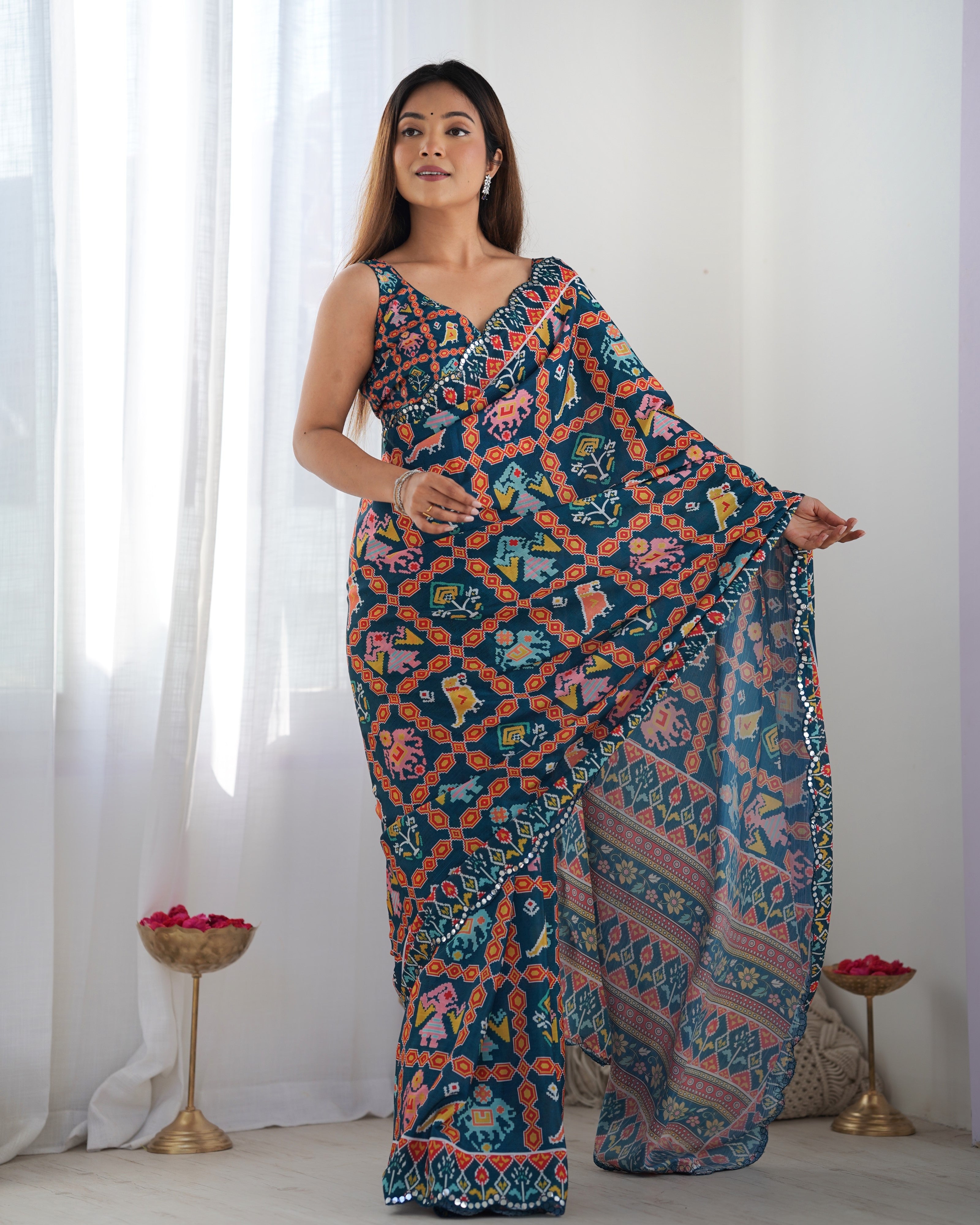 TRENDBUY DVS-12 Heavy Chinnon Saree with vibrant print & Kutchi mirror work lace border.