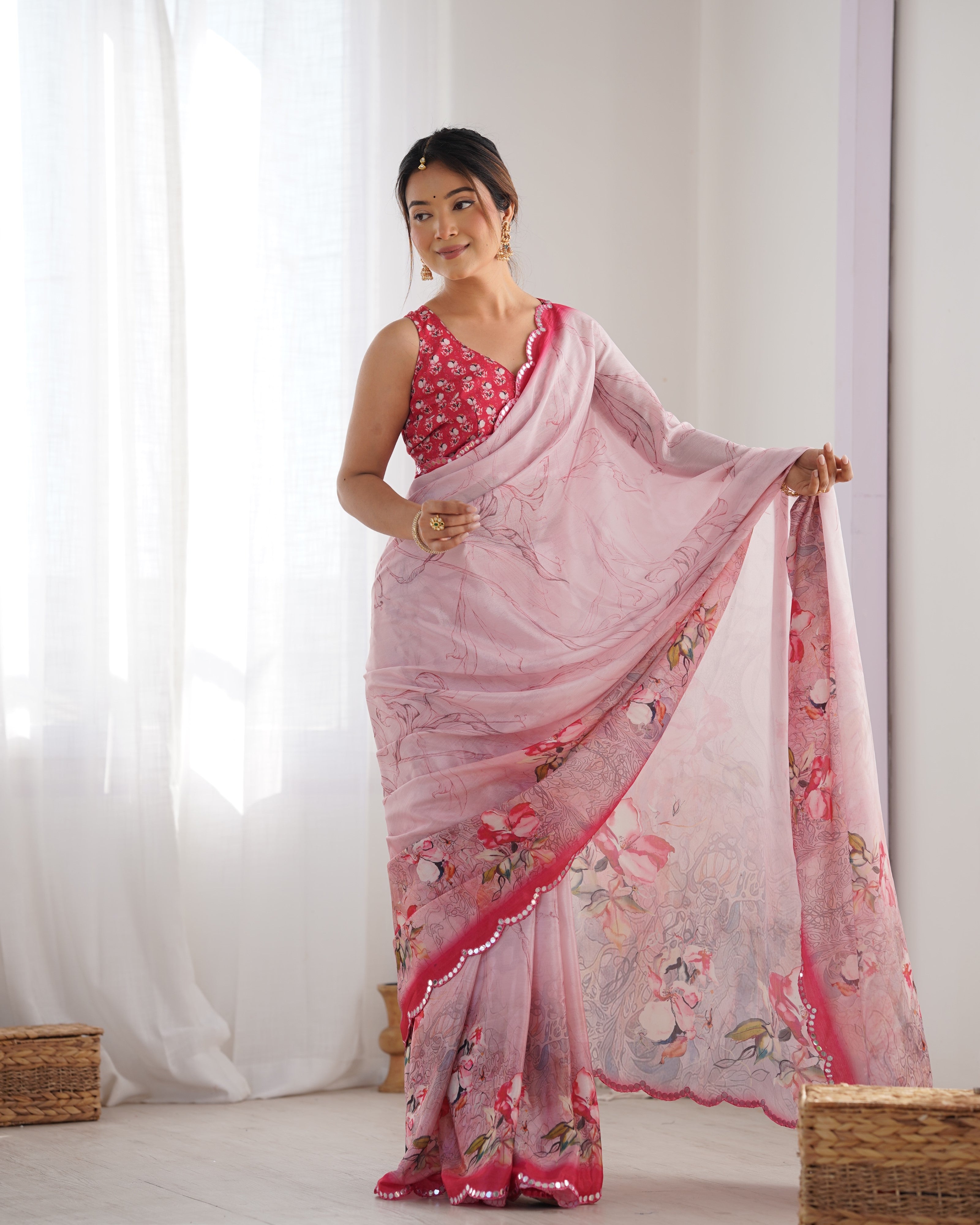 Model wearing elegant heavy Chinnon saree with intricate Kutchi mirror work and coordinating floral print blouse.