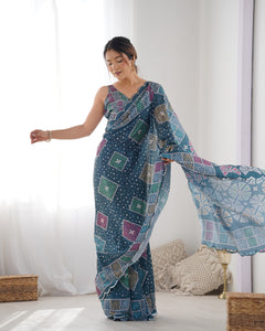 TRENDBUY Elegant Teal Heavy Chinnon Saree with Kutchi Mirror Work Lace Border & Unstitched Blouse