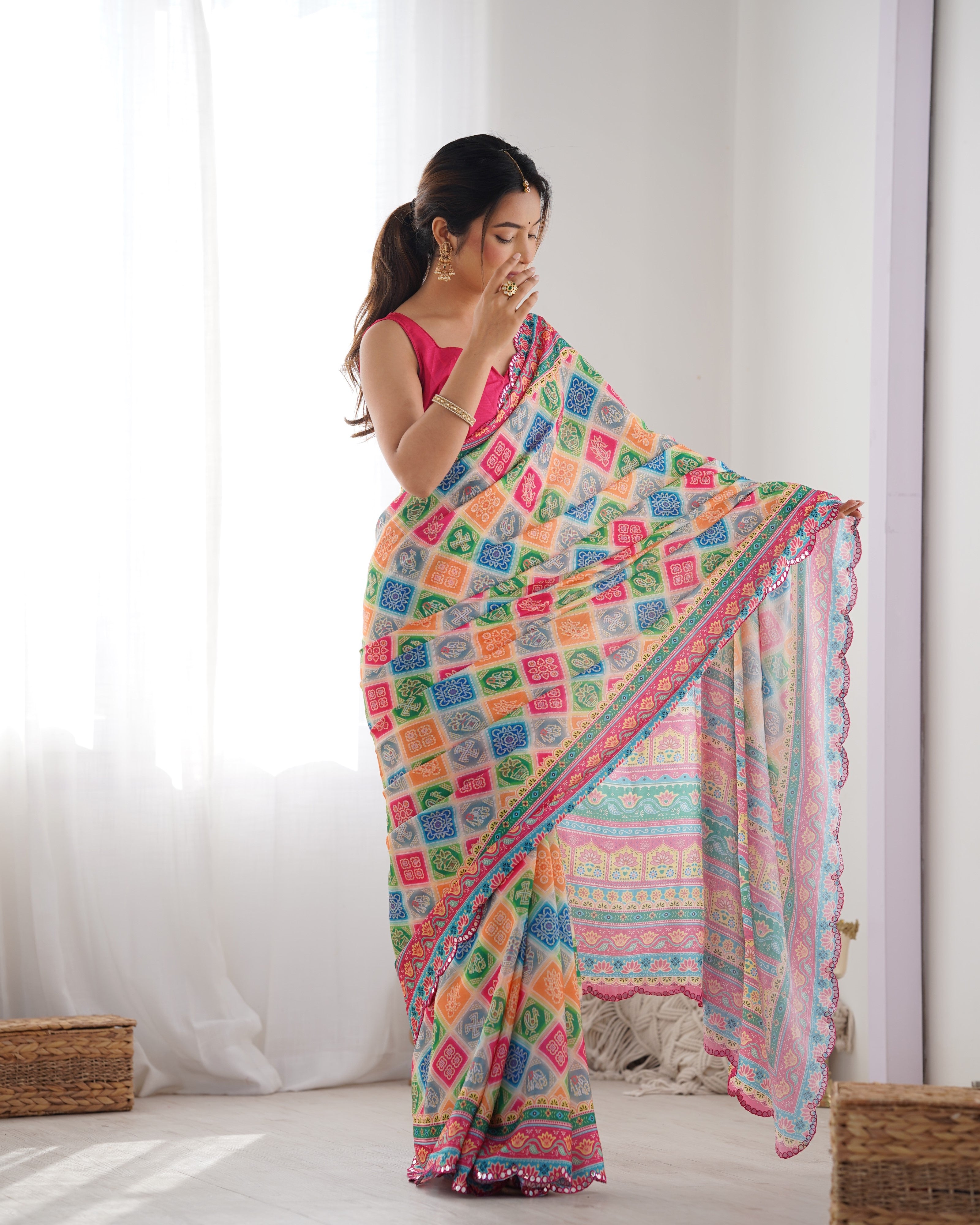 Close-up of TRENDBUY Heavy Chinnon Saree with vibrant print and intricate Kutchi mirror work border.