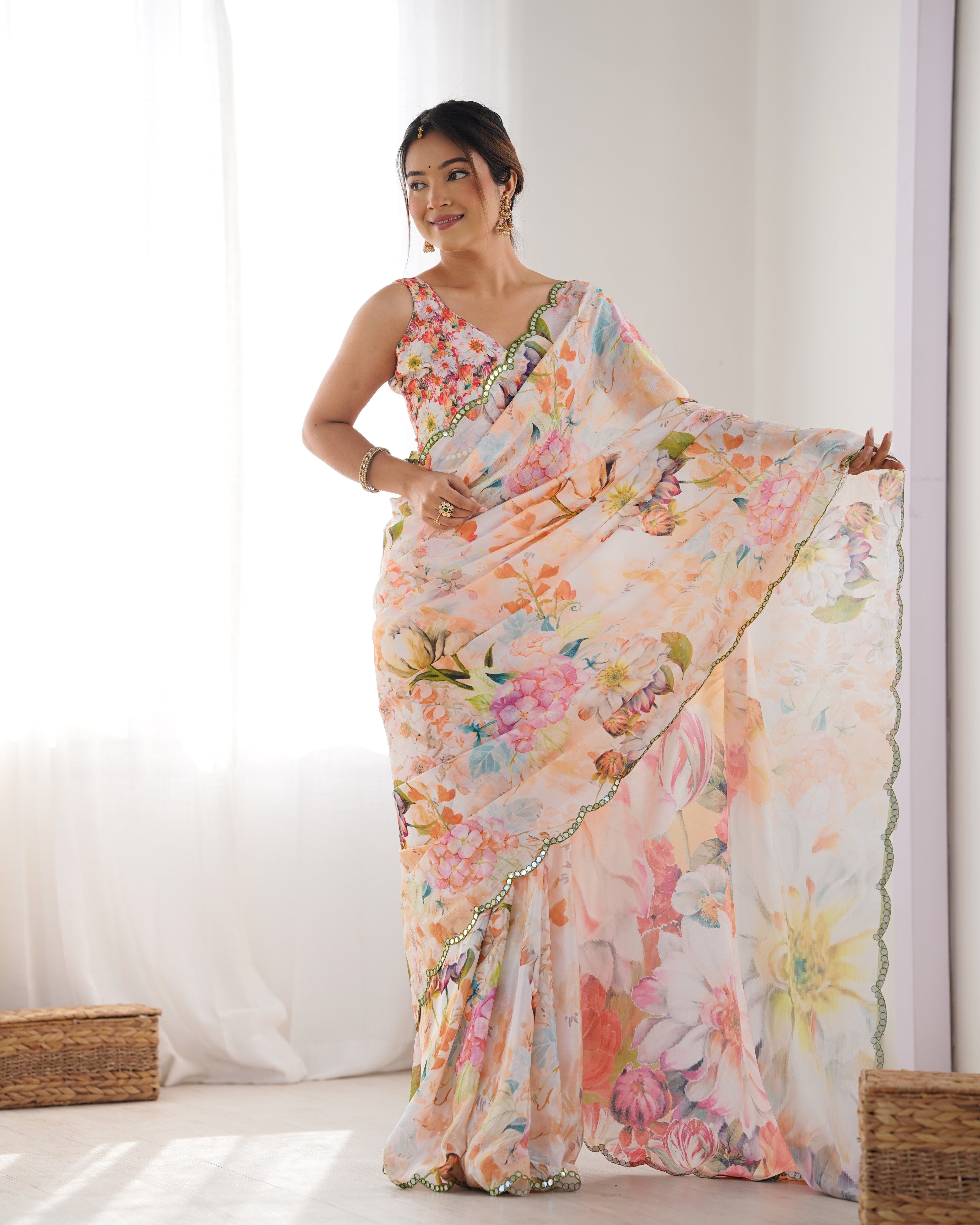Full length shot of model gracefully posing in the TRENDBUY DVS-22 floral print saree with Kutchi mirror work.
