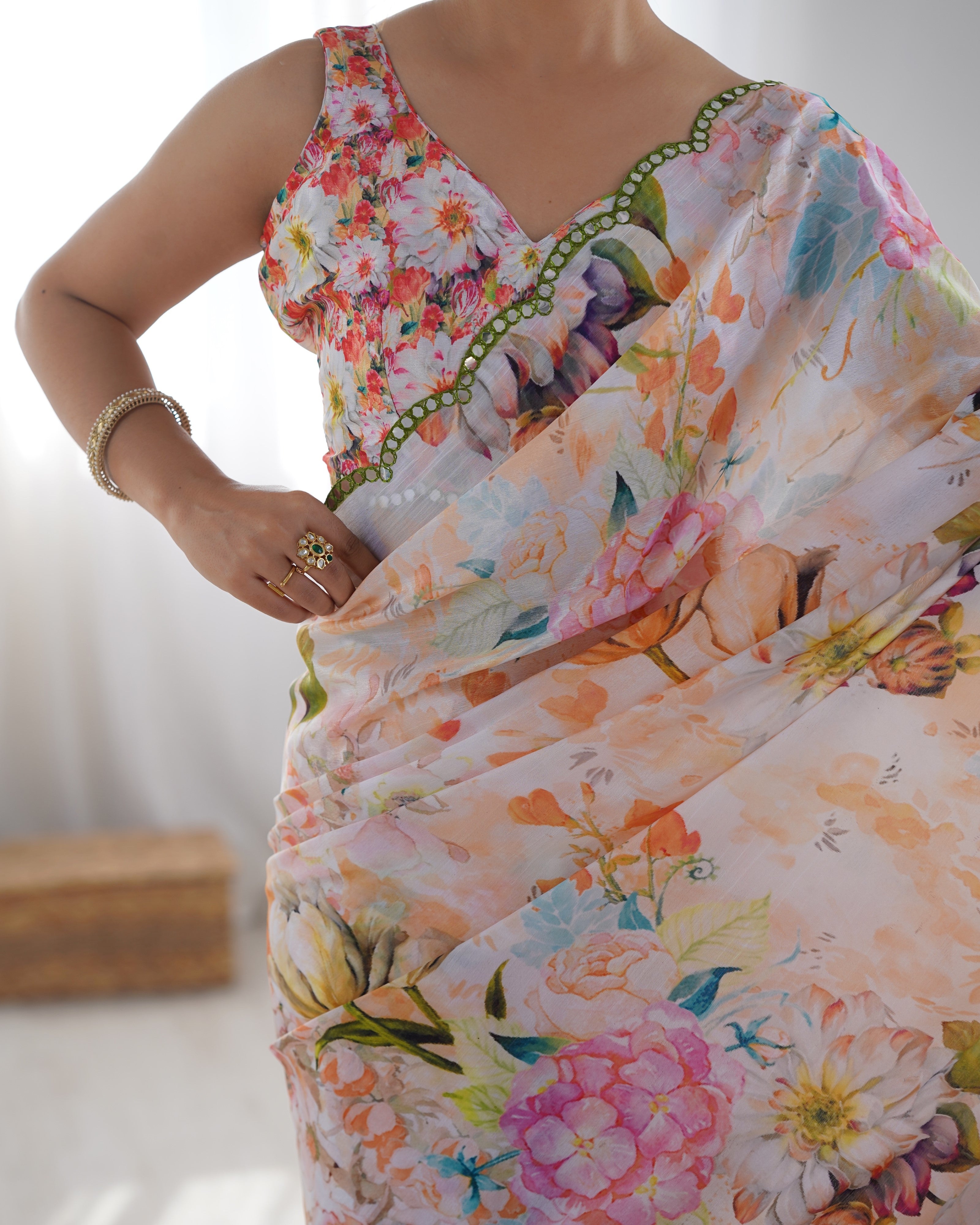 Close-up of the heavy chinnon fabric and detailed Kutchi mirror work border on the TRENDBUY saree.