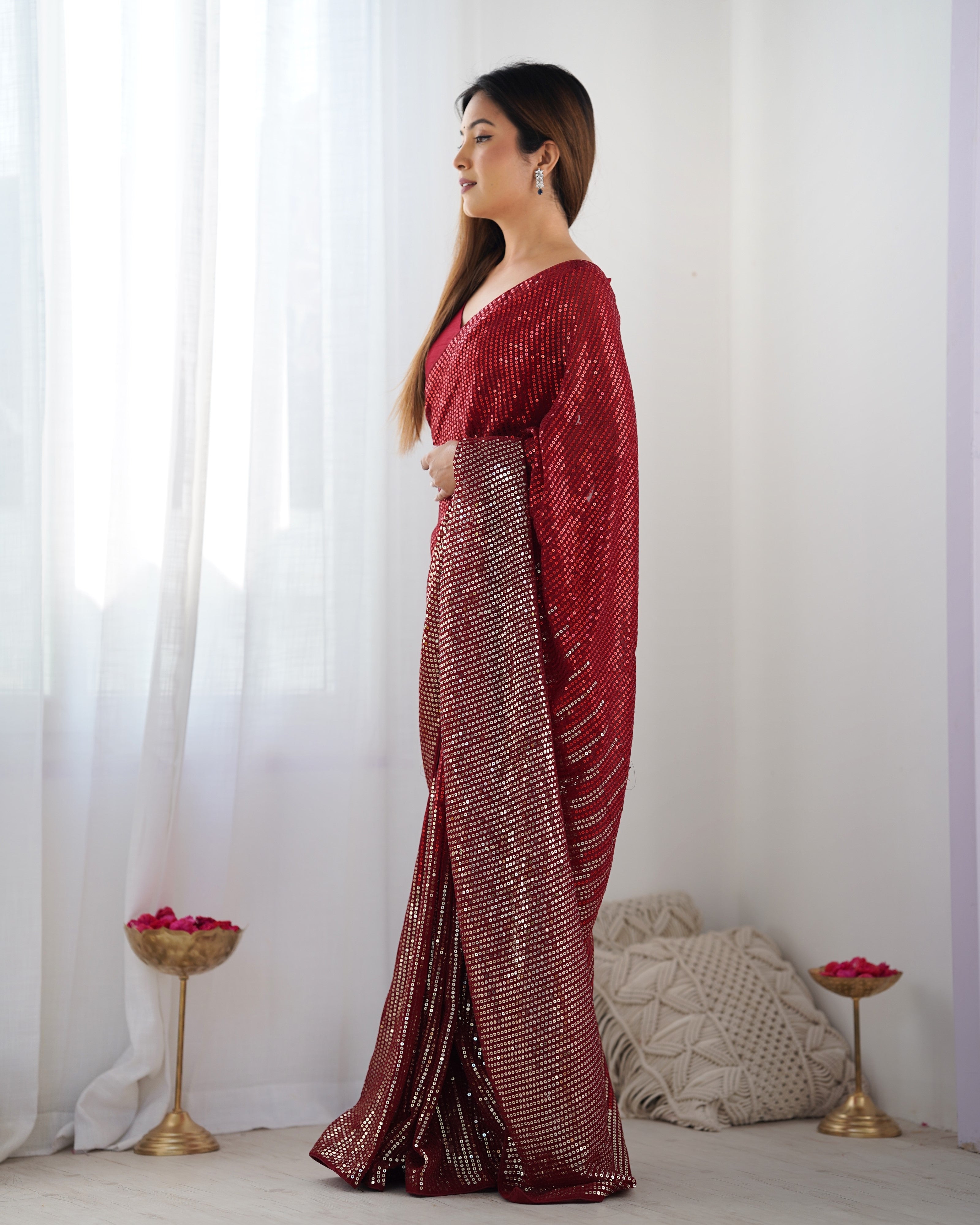 Woman wearing TRENDBUY DVS-23 Ruby Red Georgette Saree, side profile