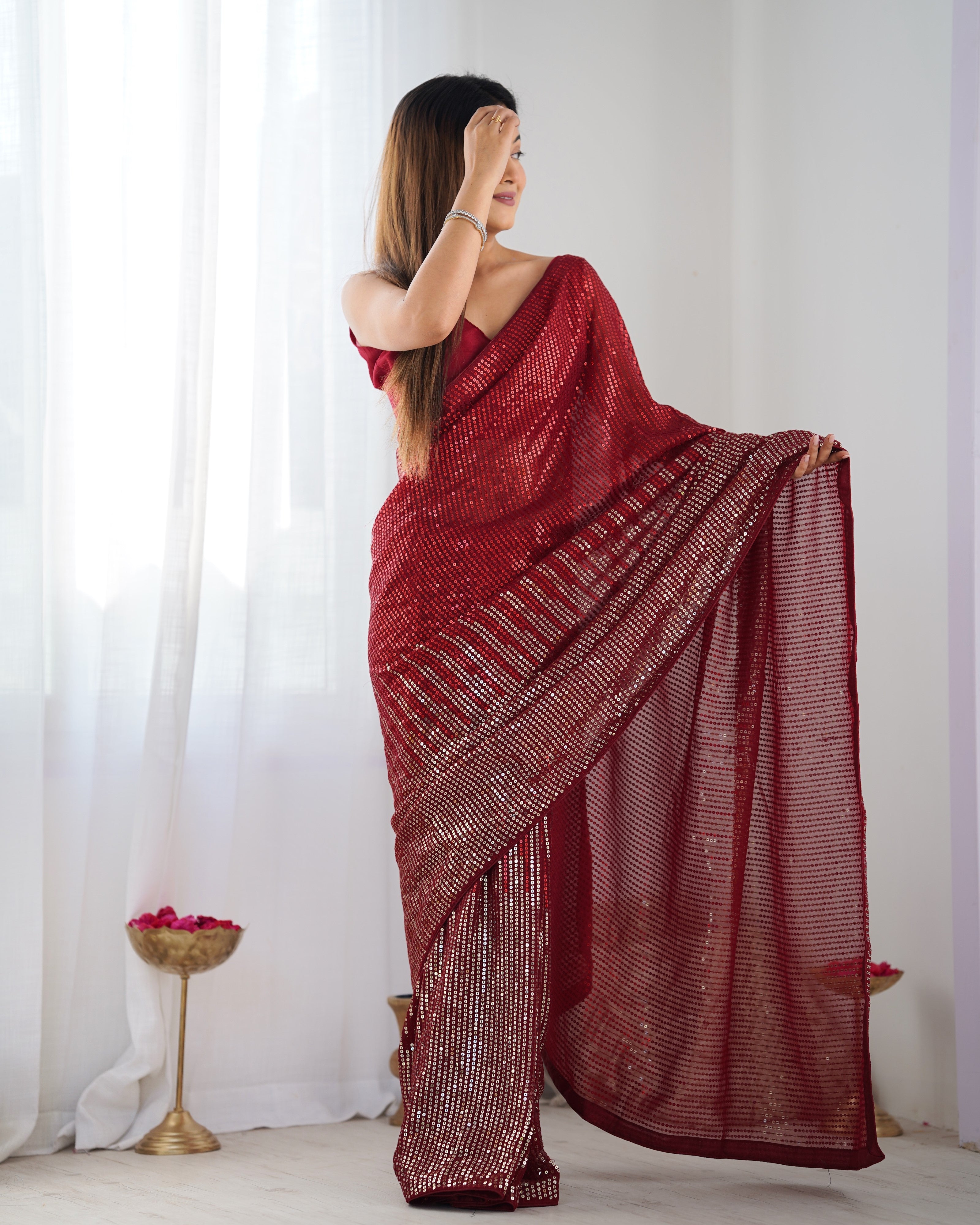 Woman posing playfully in TRENDBUY DVS-23 Ruby Red Sequin Saree