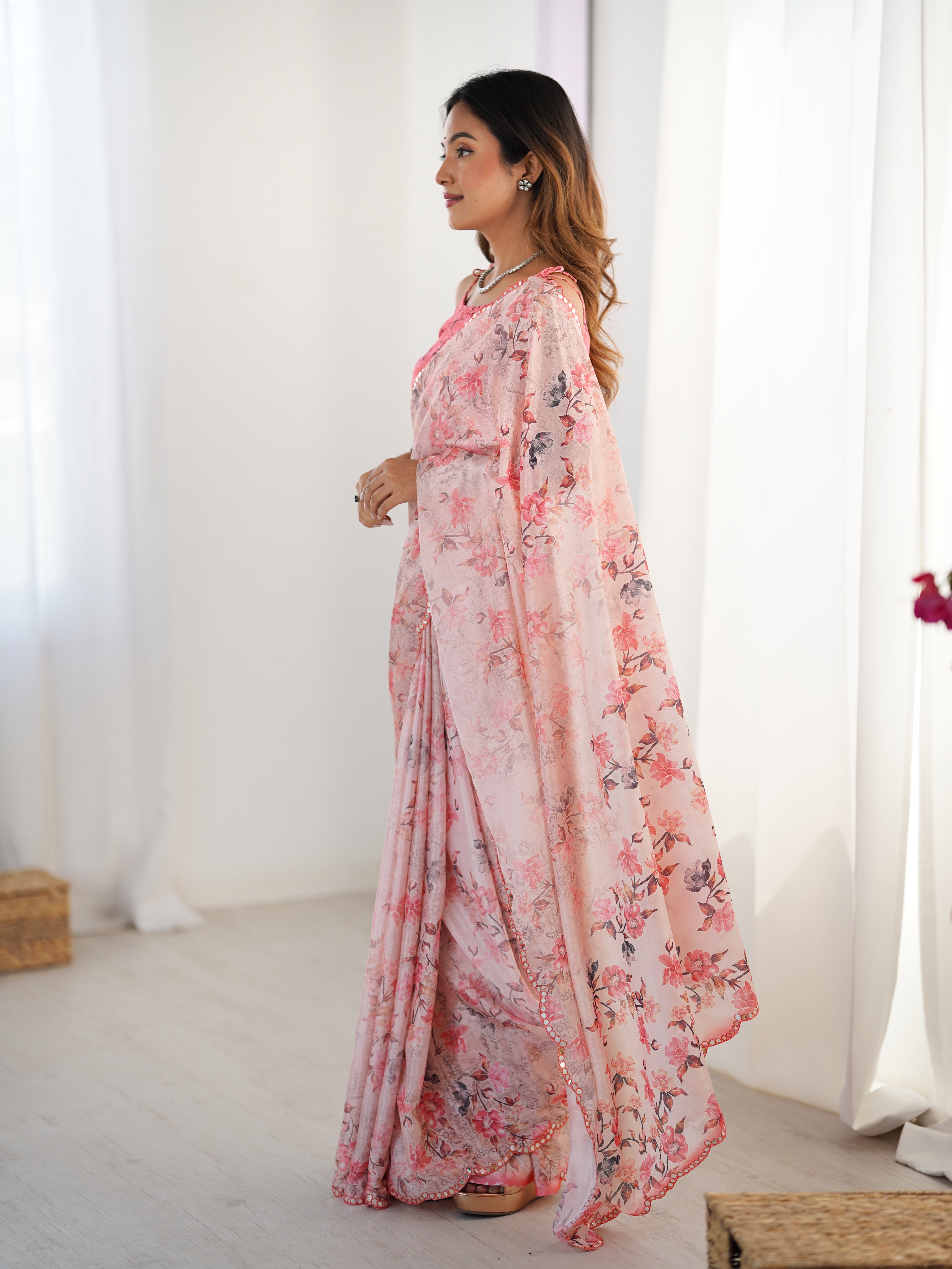 Side view of the model showcasing the elegant drape and floor-length fall of the TRENDBUY floral chinnon saree.