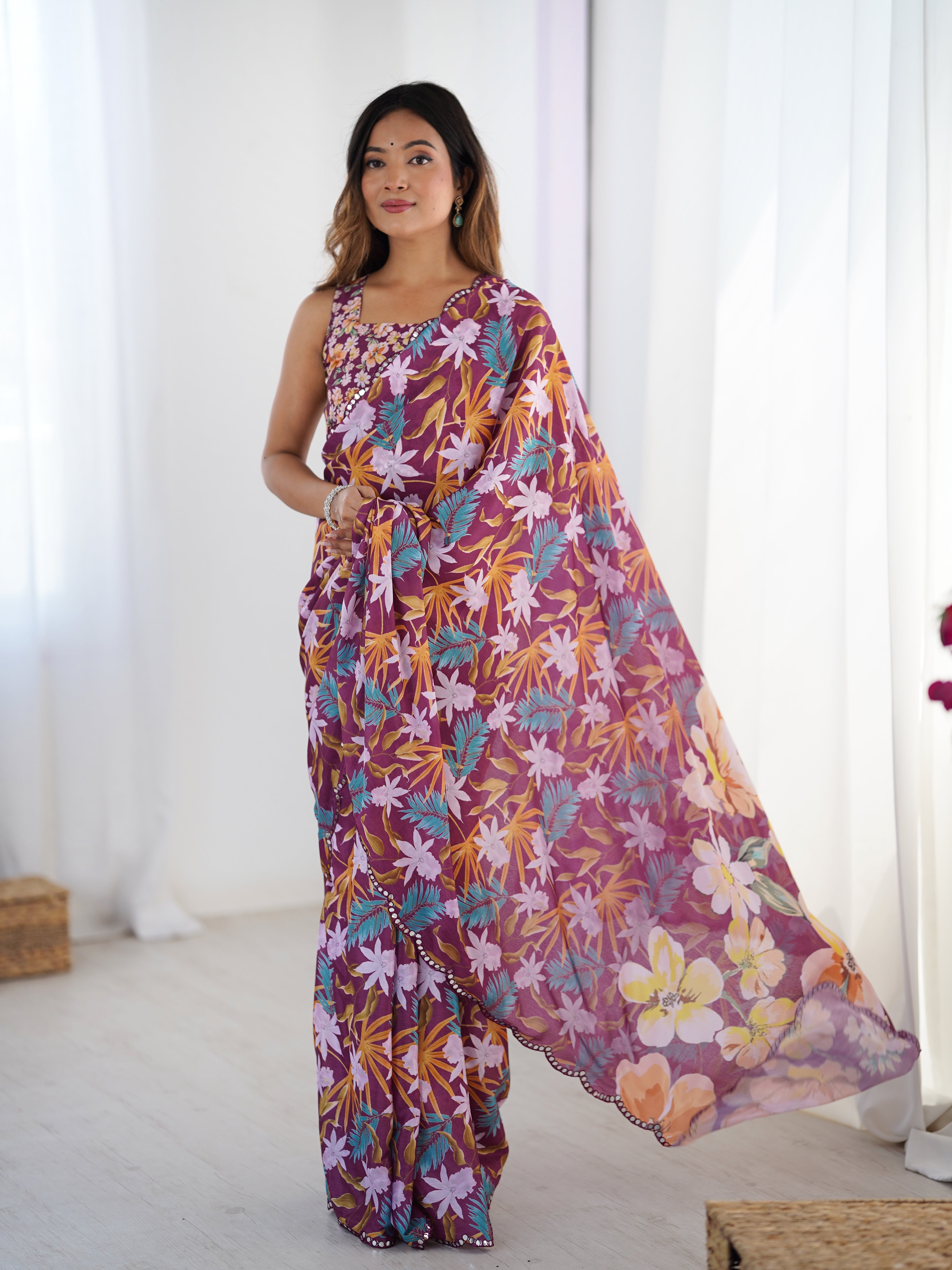 Full shot of a woman standing confidently in a TRENDBUY DVS-31 floral print Chinnon saree with an embellished blouse.