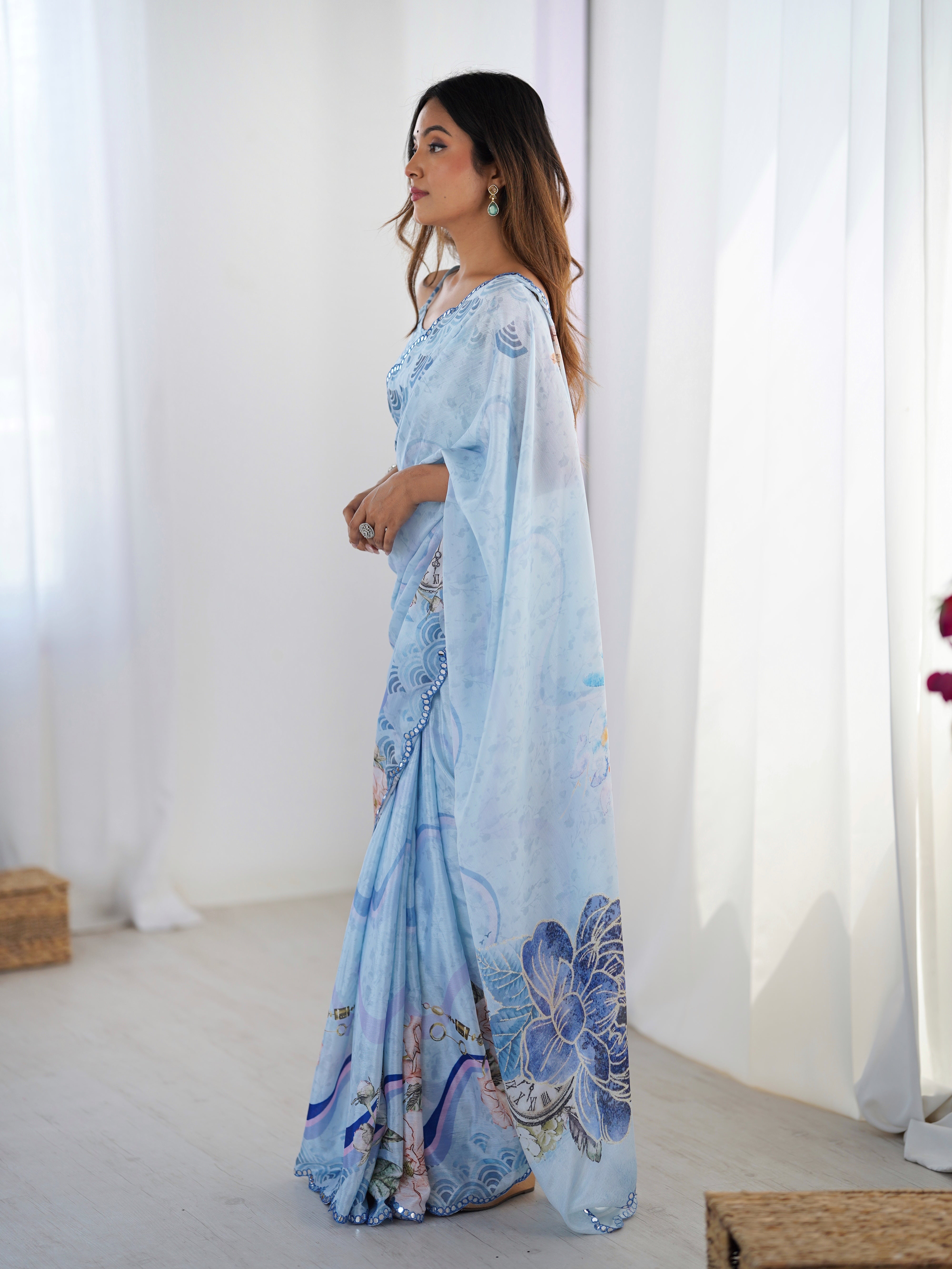 Elegant Sky Blue Chinnon Saree with Kutchi work mirror lace border.