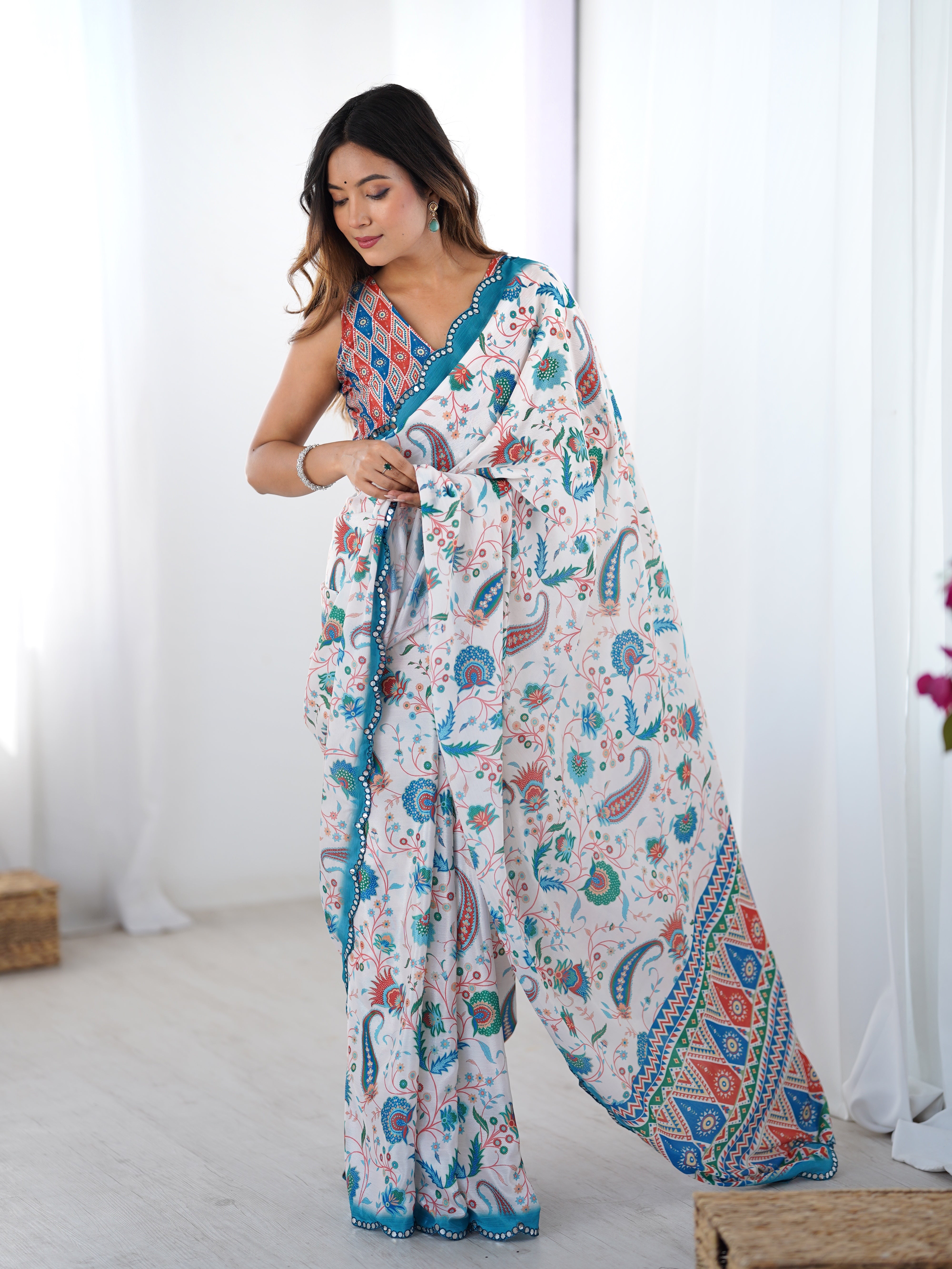 Elegant heavy chinnon printed saree with Kutchi mirror lace and unstitched blouse.