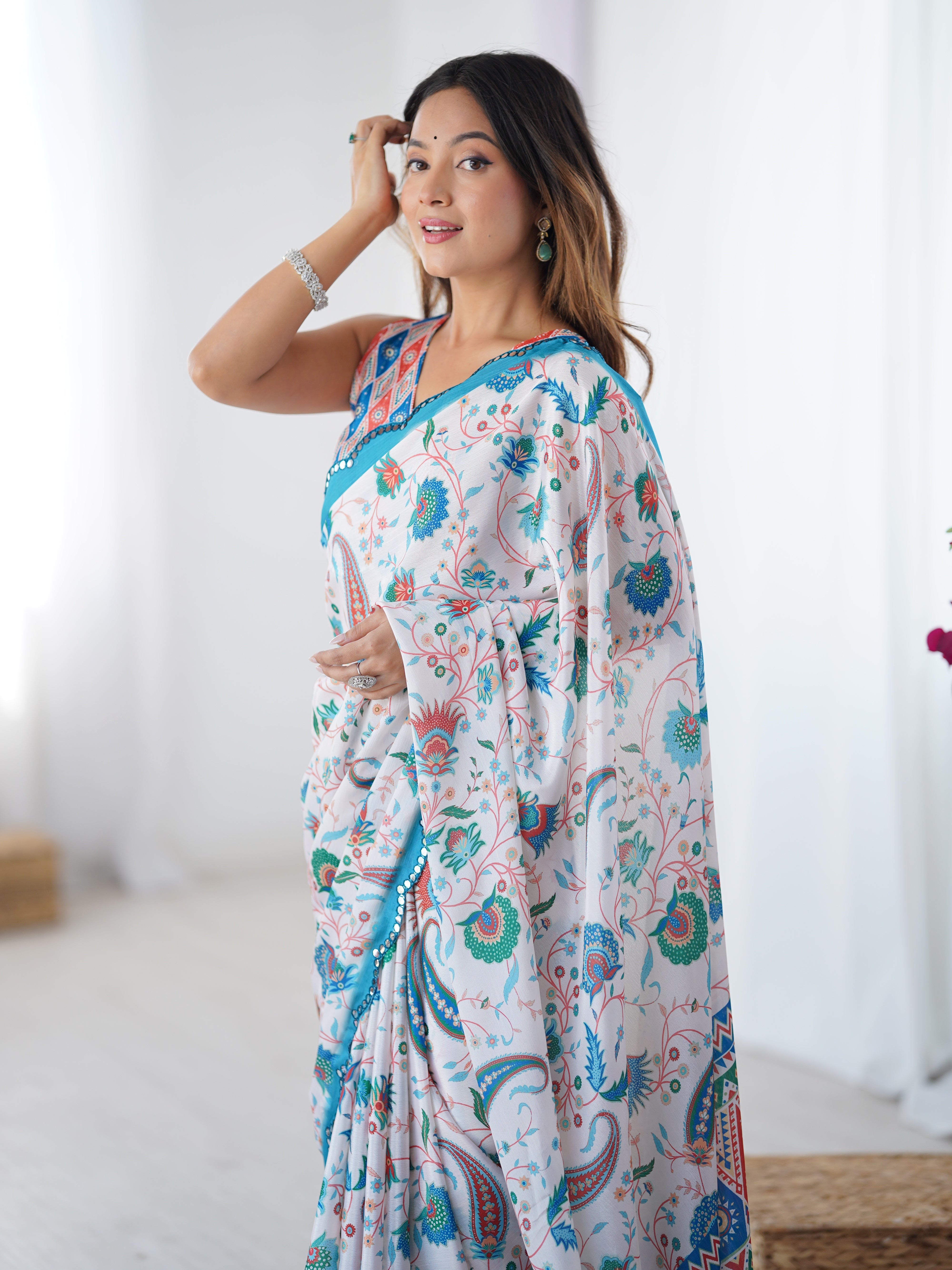 Elegant blue Chinnon printed saree for women featuring intricate Kutchi mirror lace border.