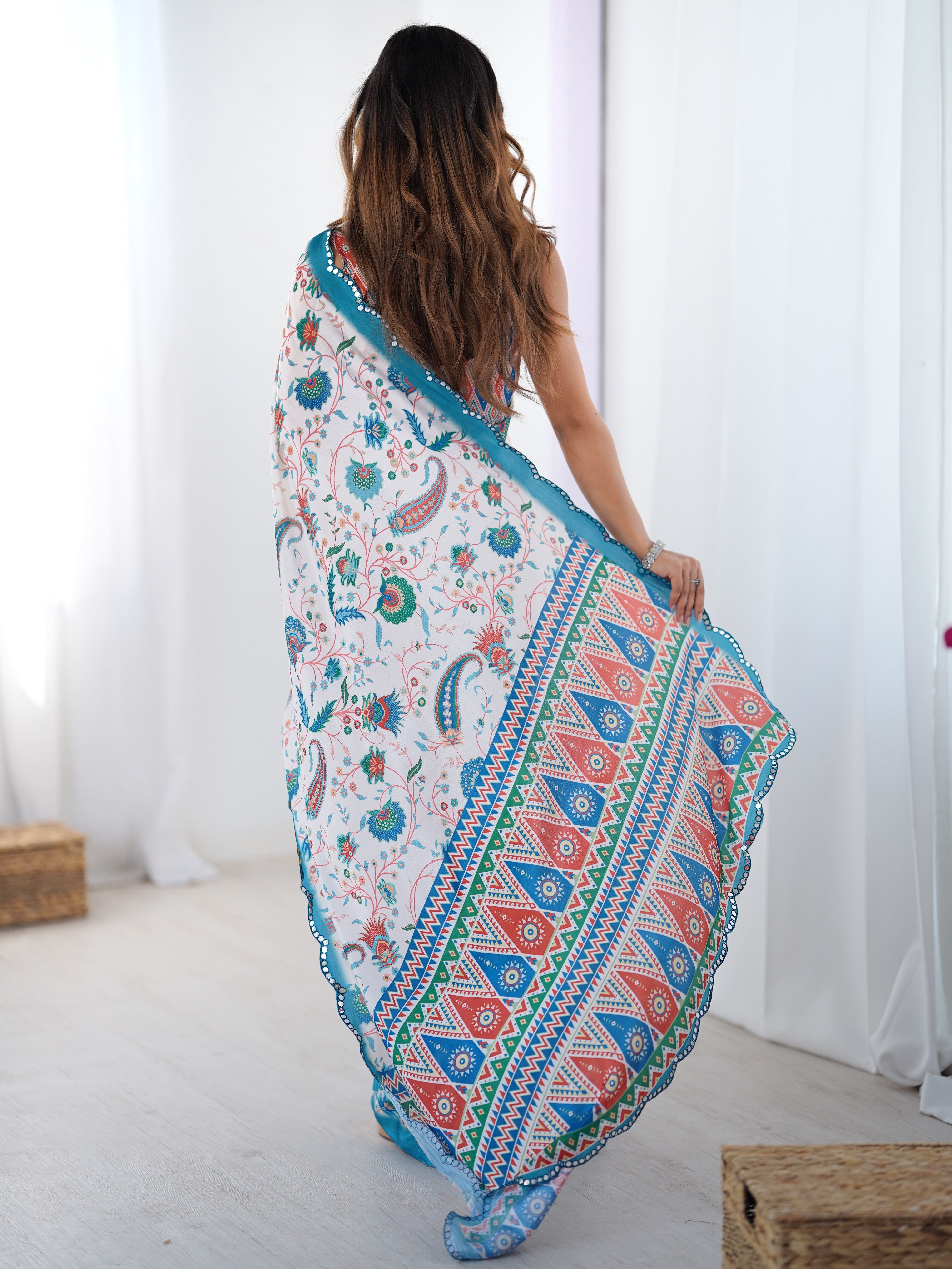 Elegant heavy Chinnon printed saree with Kutchi mirror lace worn by model.