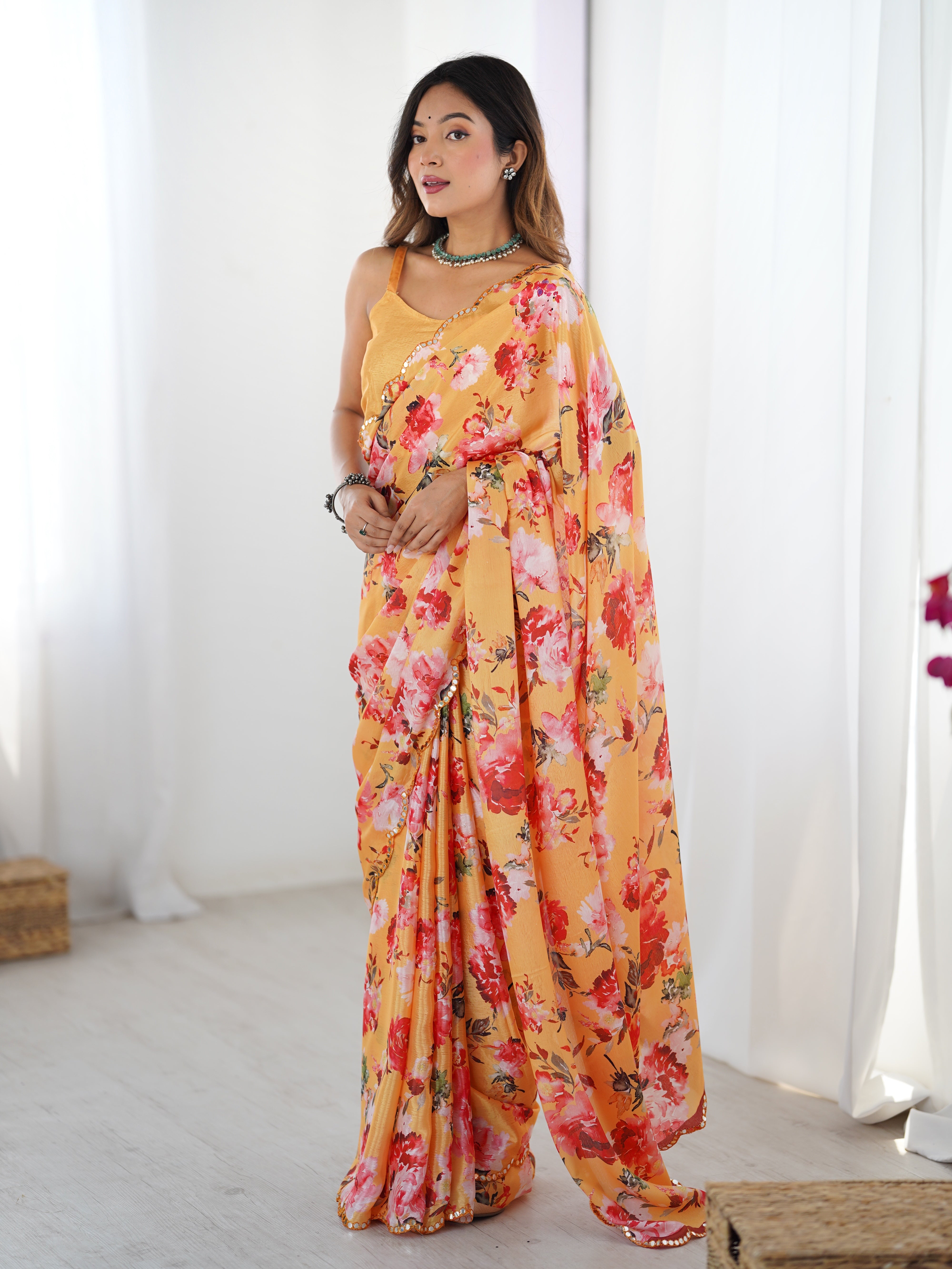 Floral print heavy chinnon saree with Kutchi mirror work border