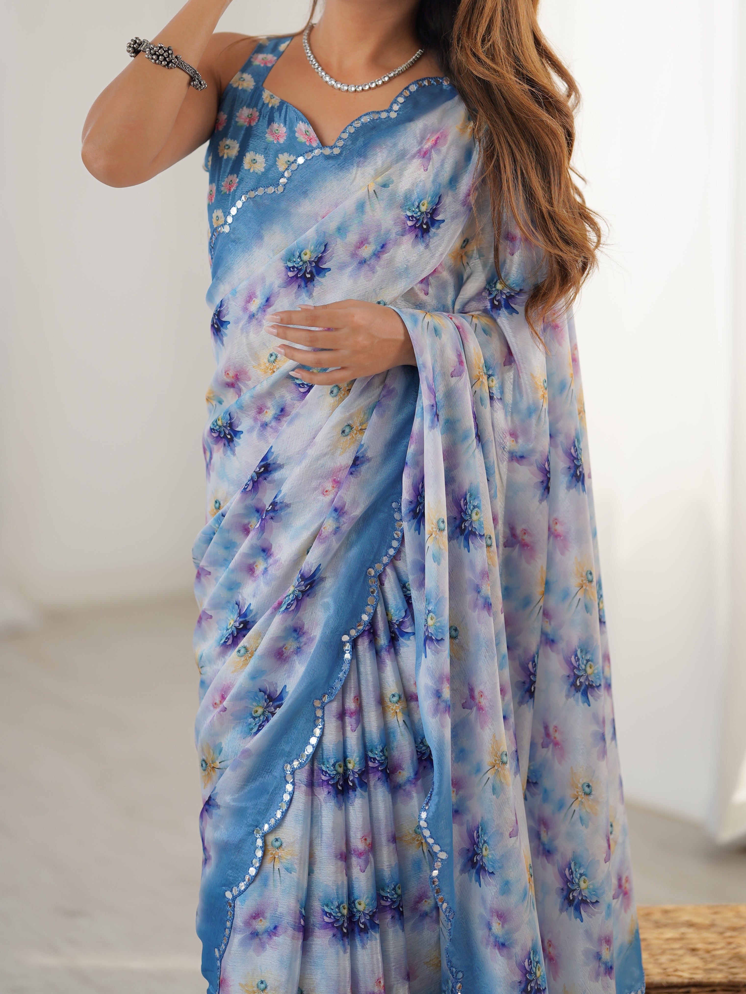 Elegant Heavy Chinnon Saree featuring vibrant floral print and intricate Kutchi mirror work border.