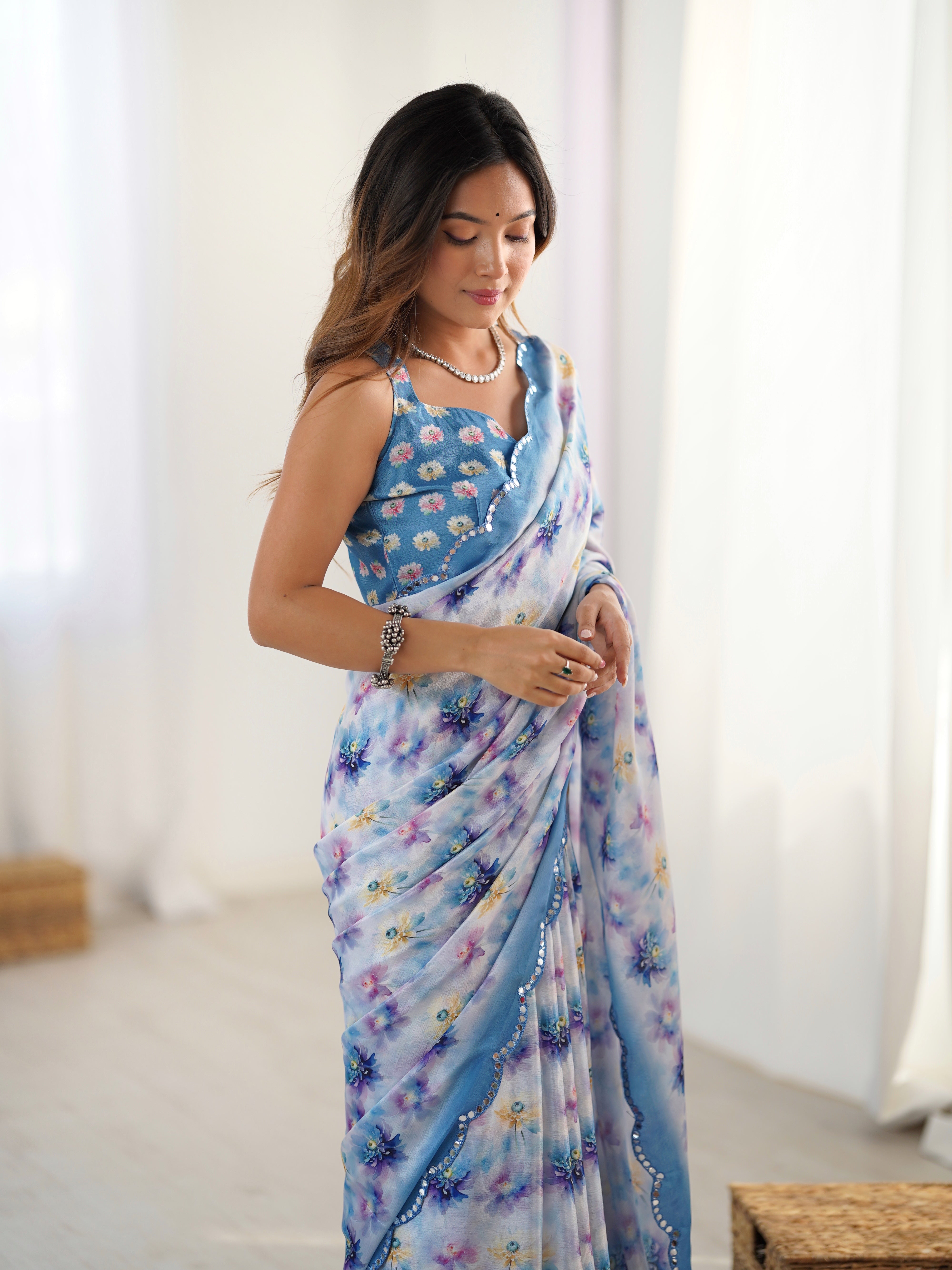 Elegant Heavy Chinnon Saree with vibrant floral print and intricate Kutchi mirror work border.