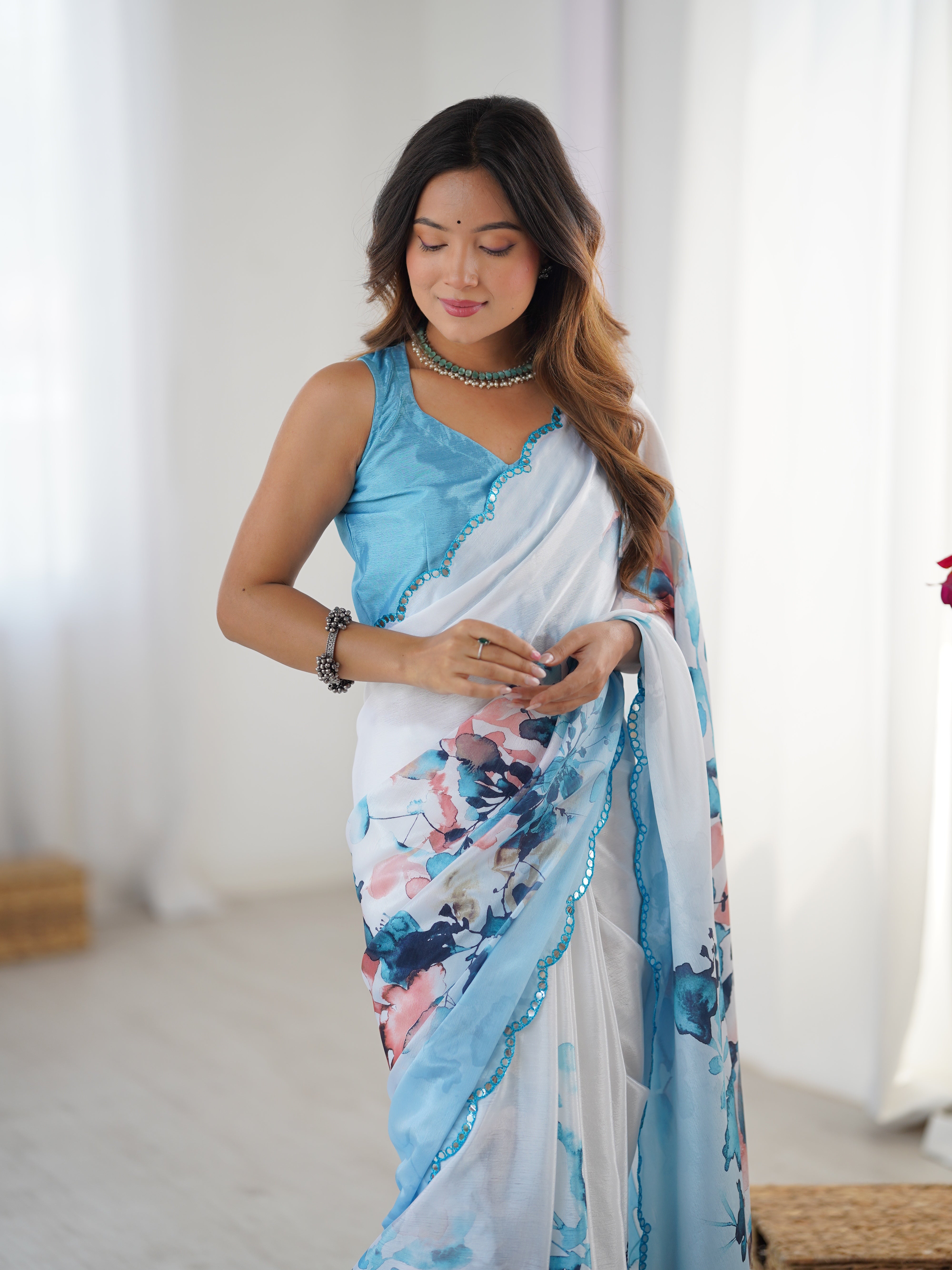 TRENDBUY Exclusive Heavy Chinnon Saree with vibrant floral print & Kutchi mirror lace border.