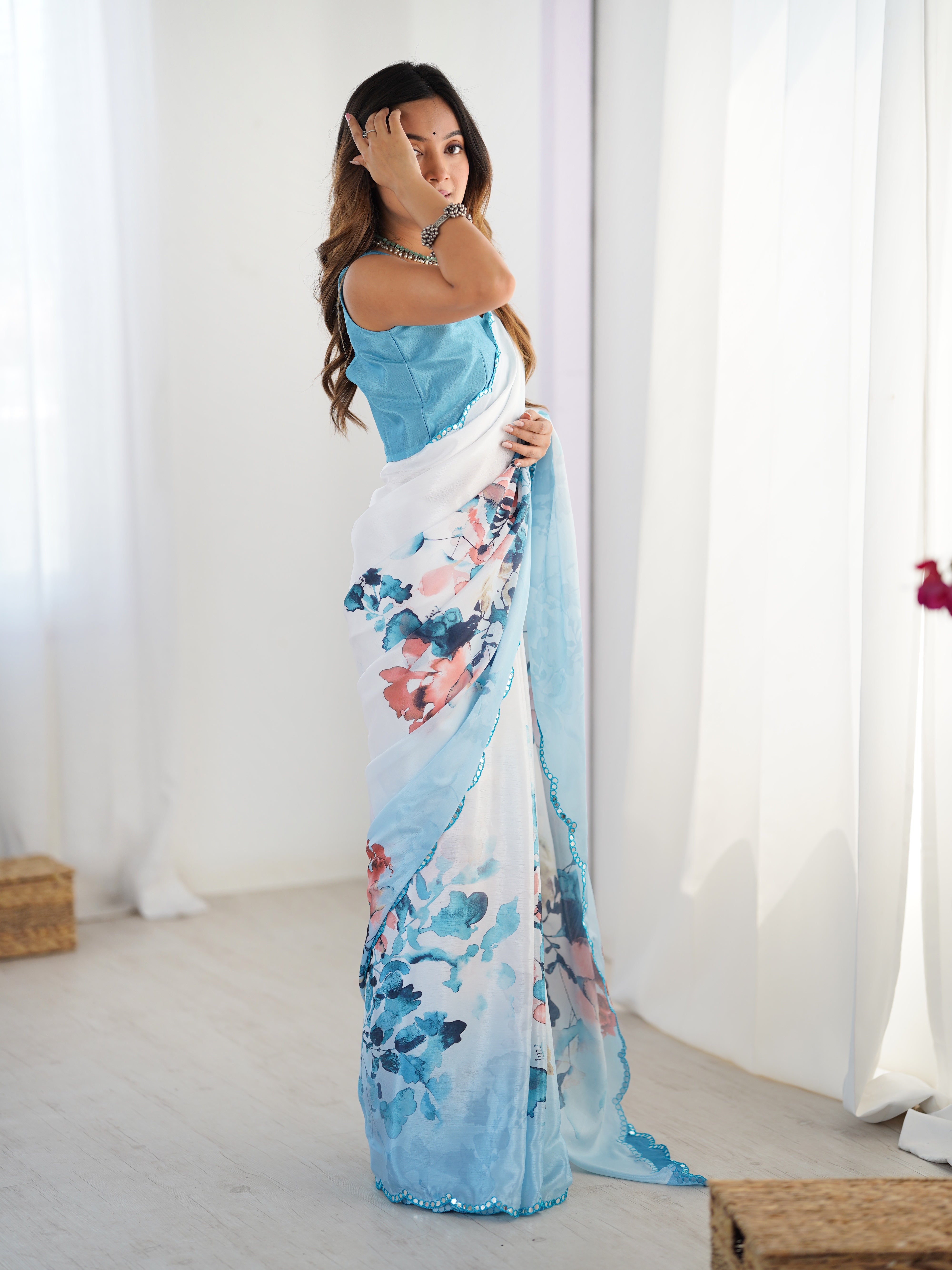 Vibrant floral print heavy chinnon saree with intricate Kutchi mirror lace border