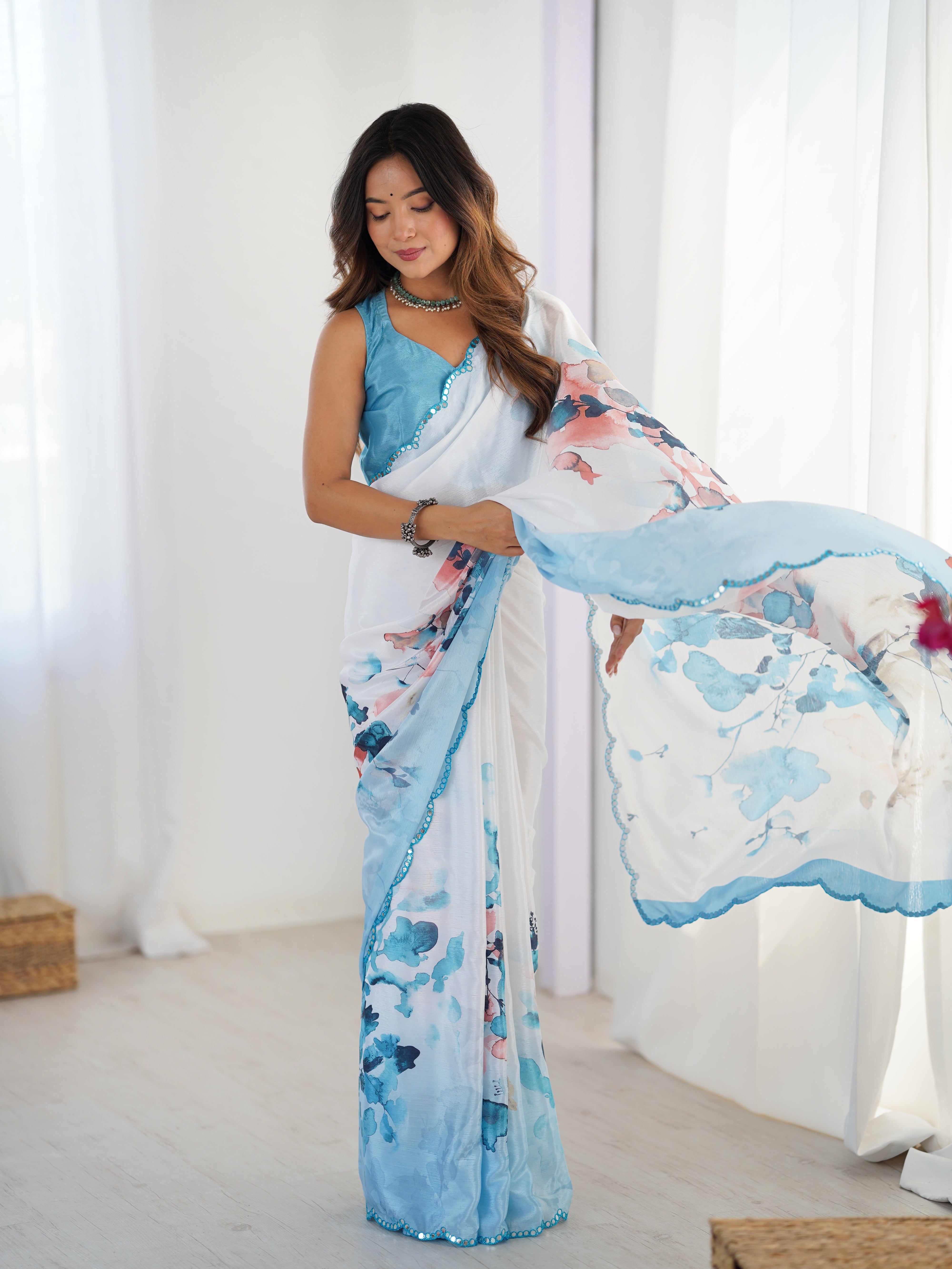 TRENDBUY heavy Chinnon saree with vibrant floral print & Kutchi mirror lace border.