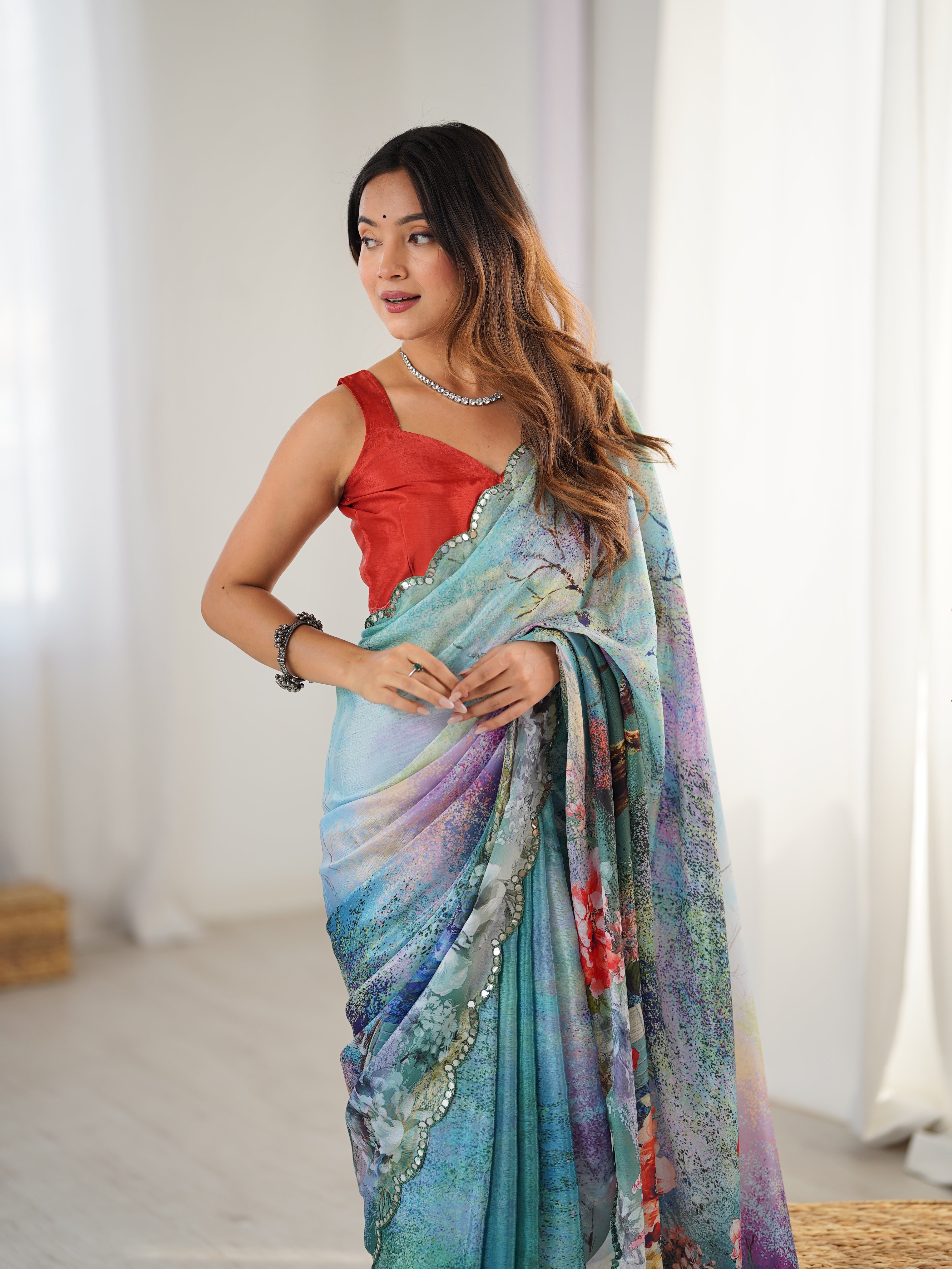 TRENDBUY Exclusive Heavy Chinnon Saree with vibrant print work and Kutchi mirror lace border
