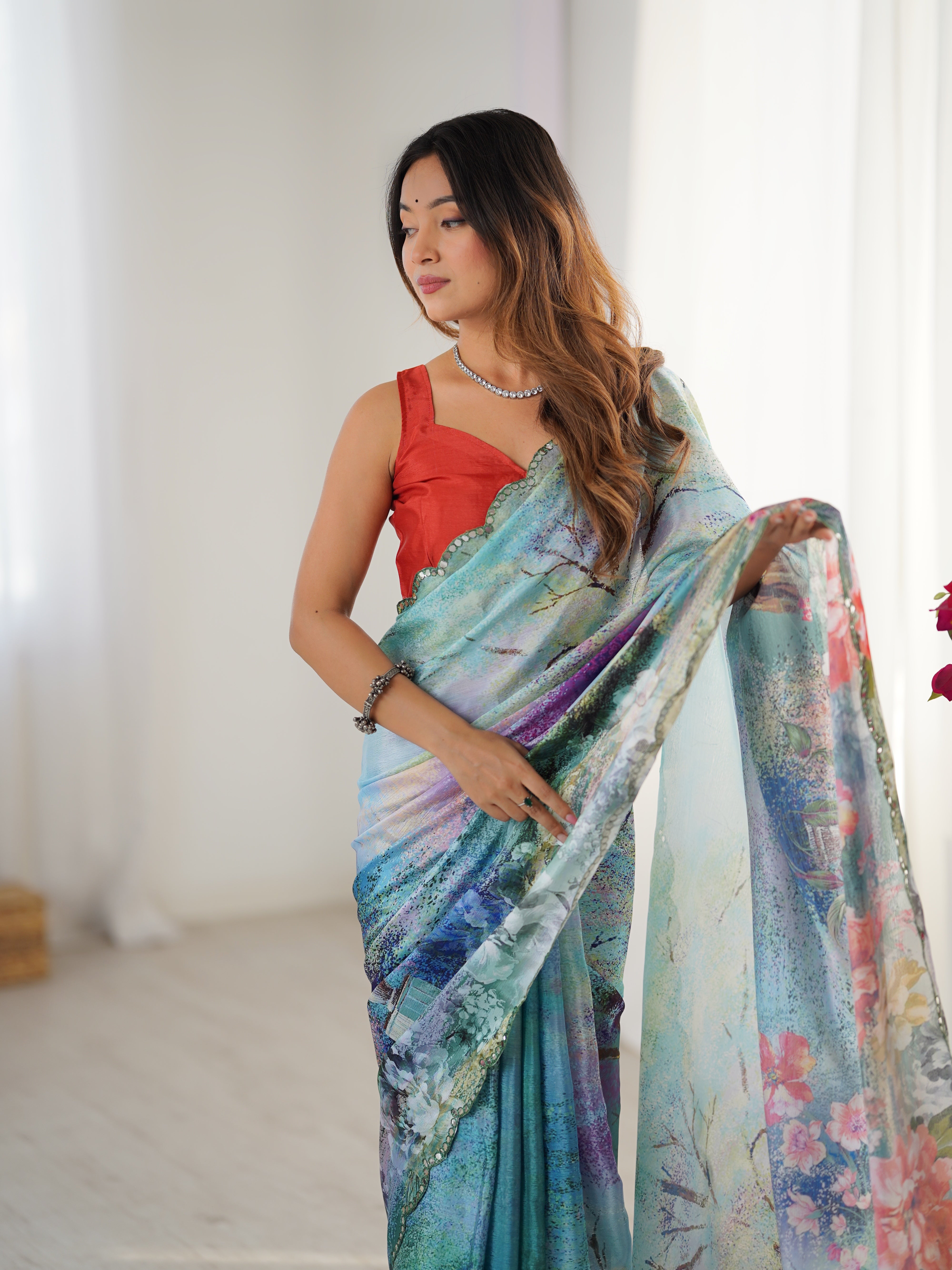 Heavy Chinnon Saree featuring vibrant print work and an intricate Kutchi mirror lace border.