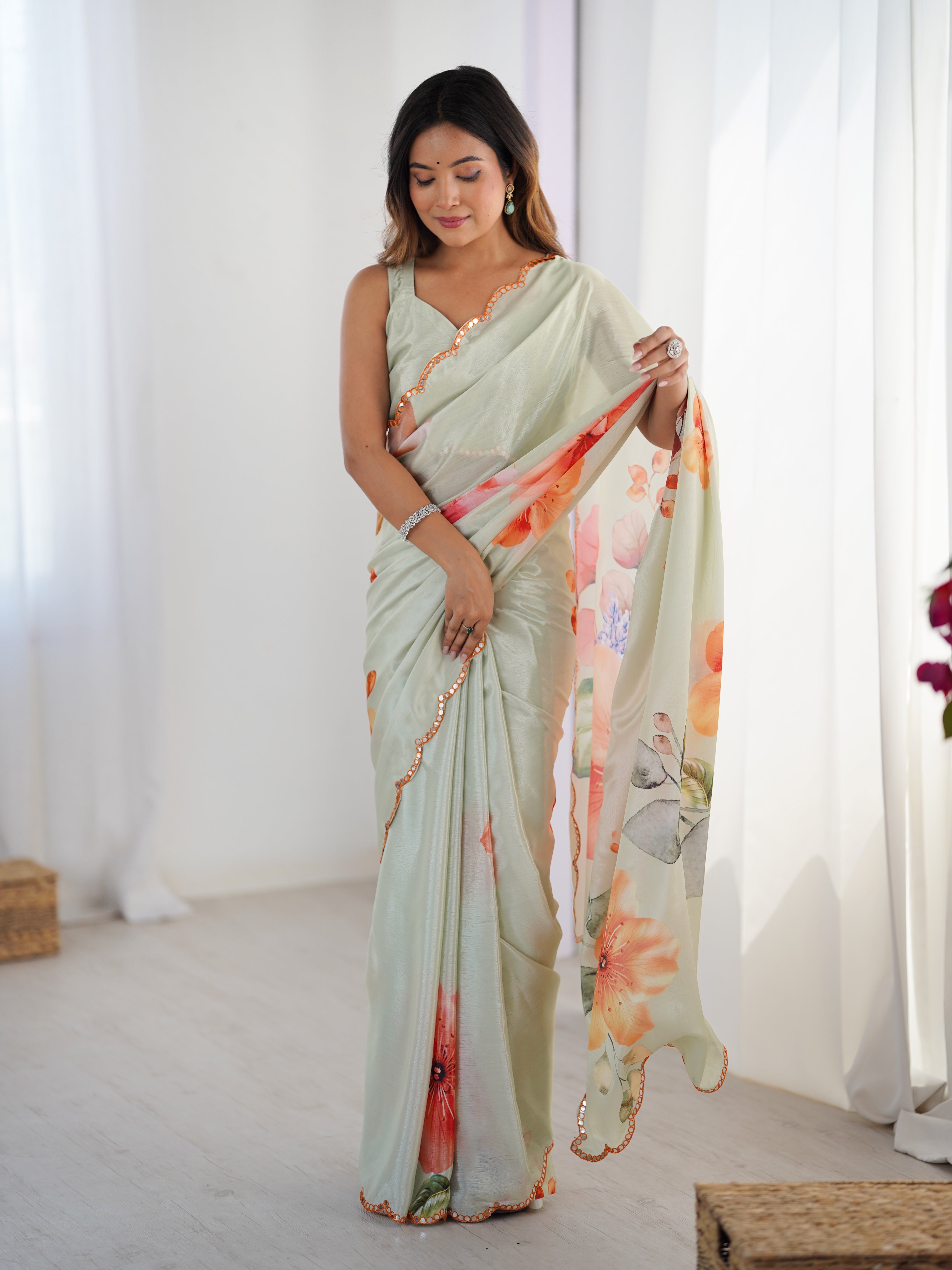 Elegant Heavy Chinnon Saree featuring vibrant floral print & intricate Kutchi mirror lace border.