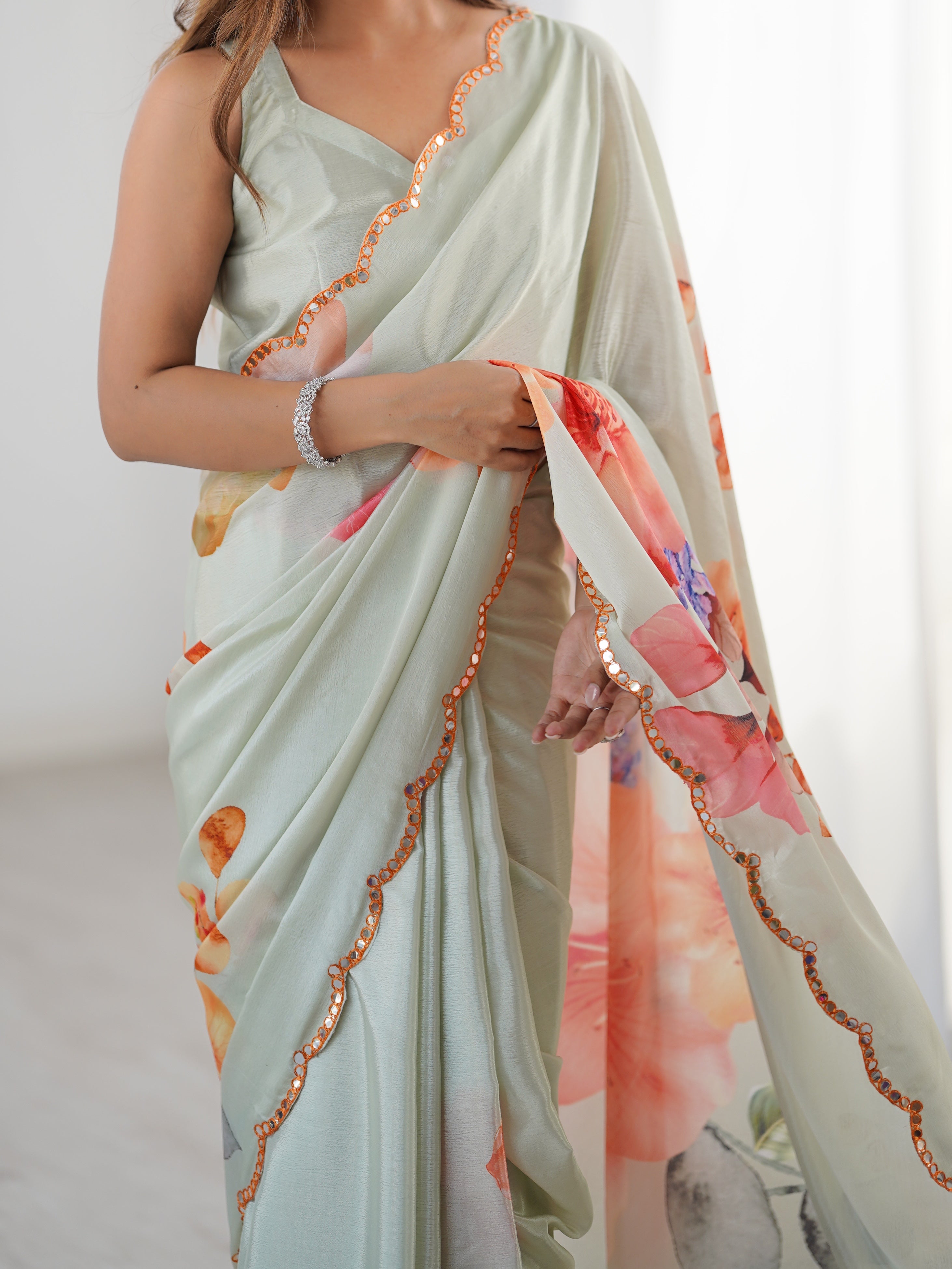 Elegant Heavy Chinnon Saree with vibrant floral print & Kutchi mirror lace border.