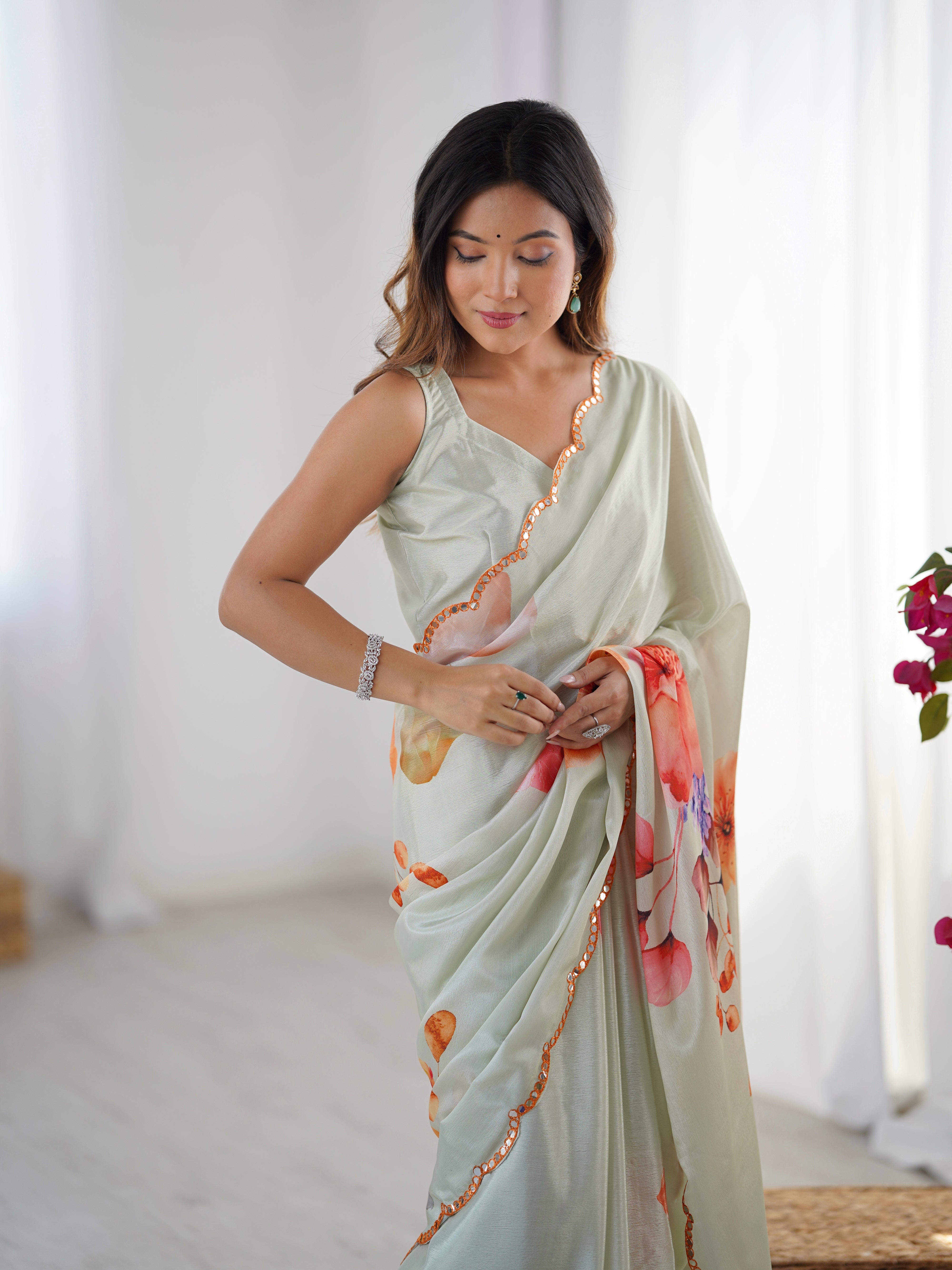 TRENDBUY Elegant Heavy Chinnon Saree: vibrant floral print, Kutchi mirror lace border.