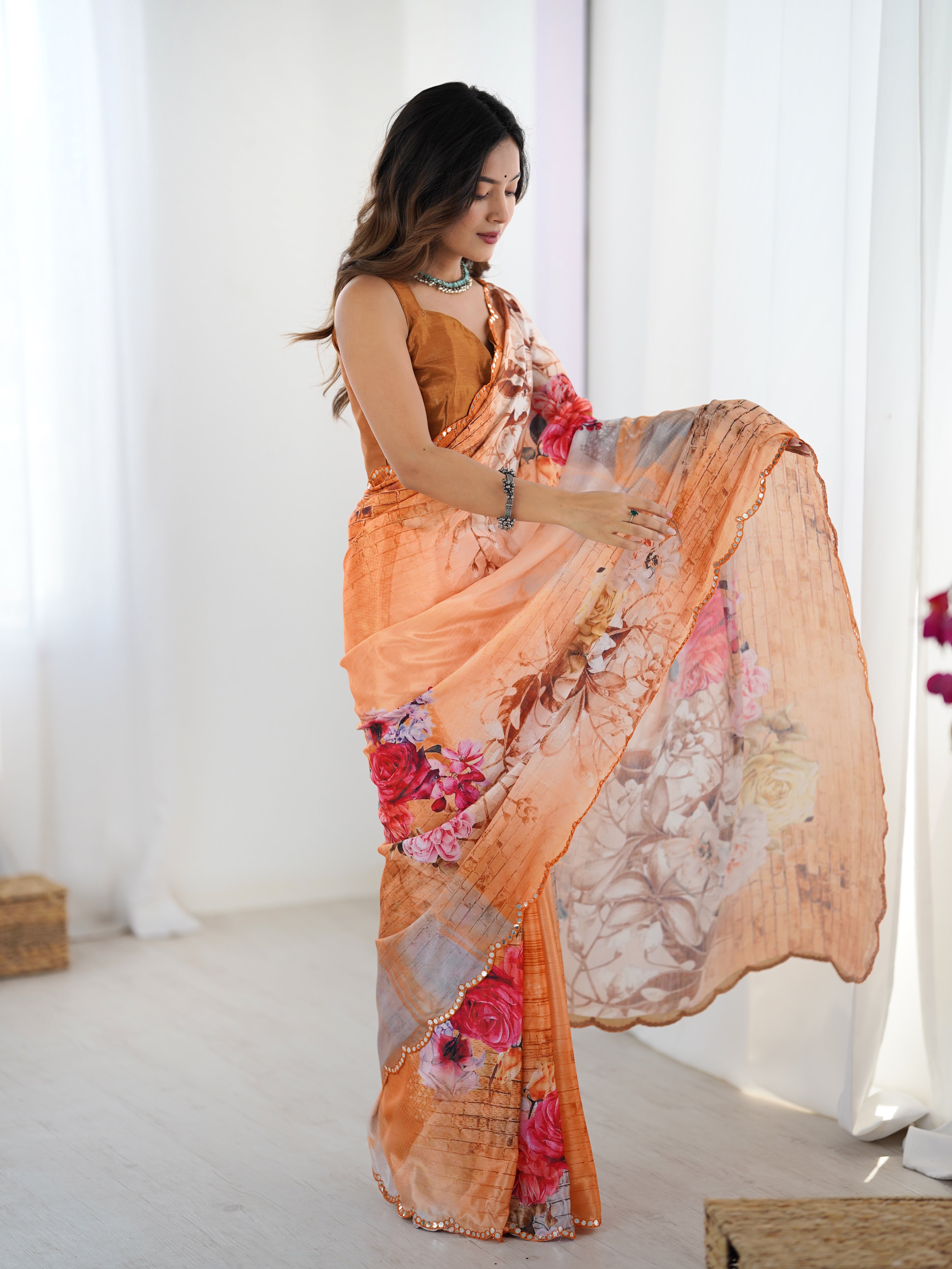Model showcasing TRENDBUY Peach Floral Heavy Chinnon Saree with Kutchi mirror border.