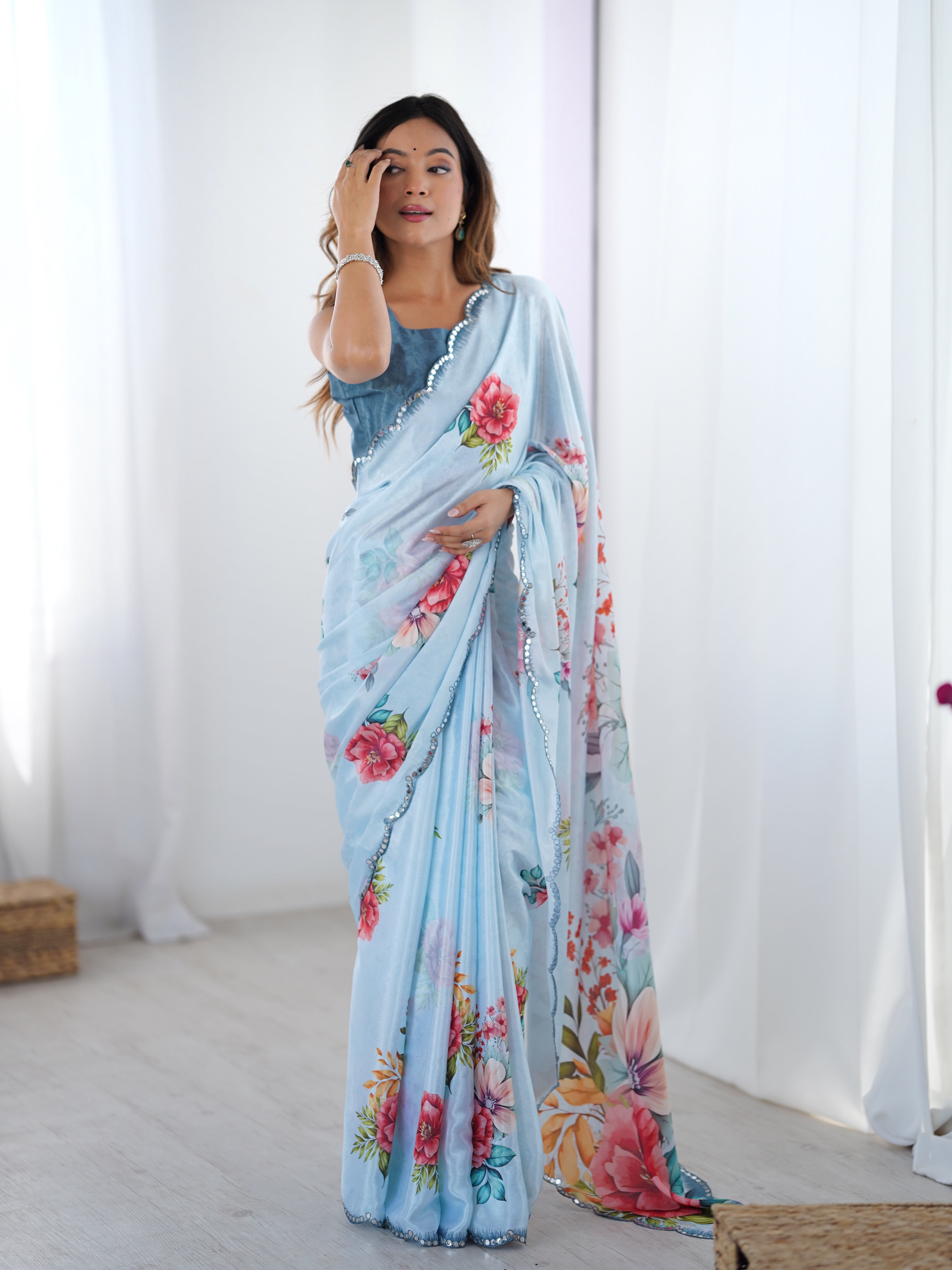 Elegant Heavy Chinnon floral print saree with Kutchi mirror lace border.