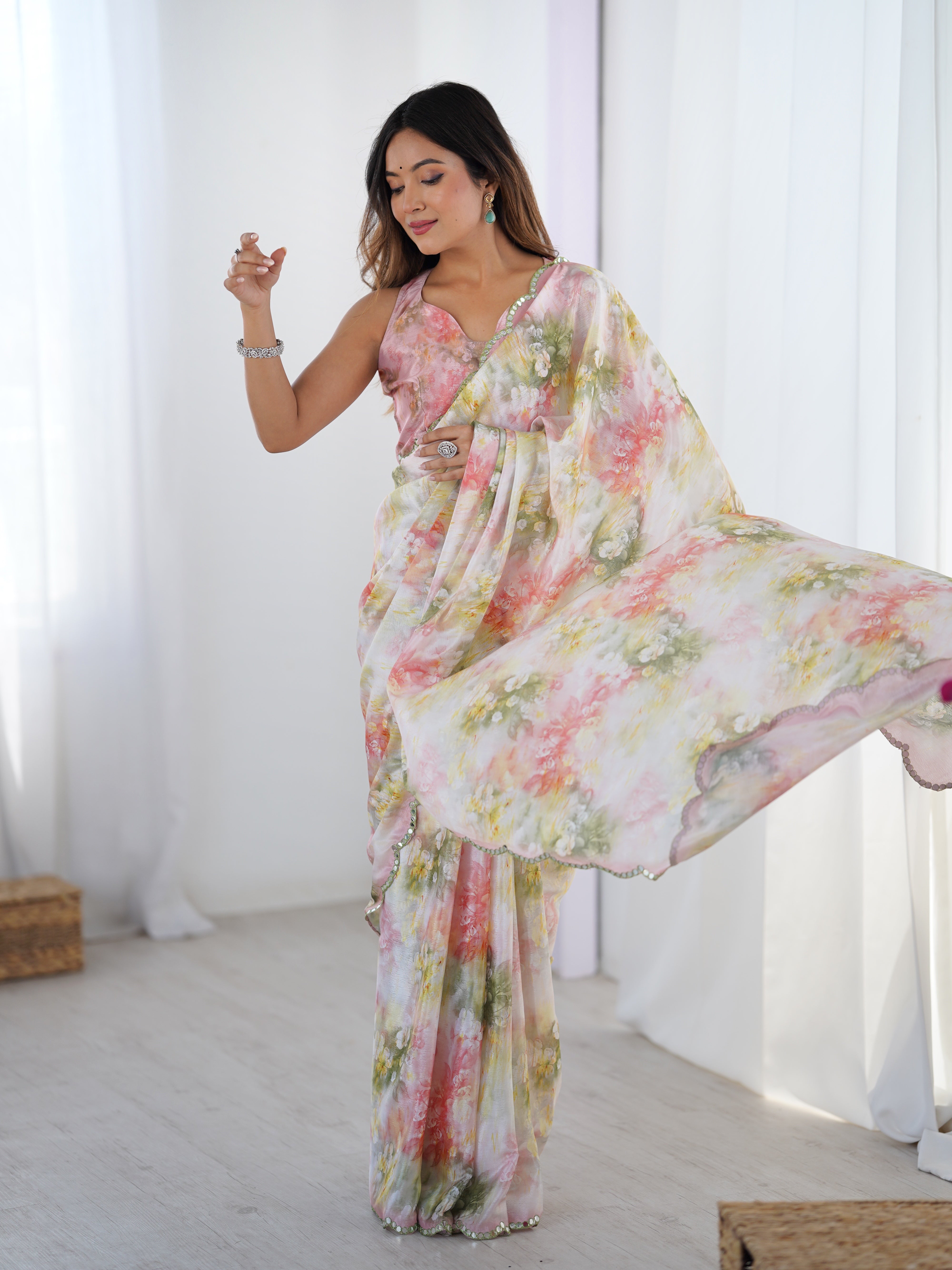 Heavy Chinnon floral print saree with intricate Kutchi work mirror lace border