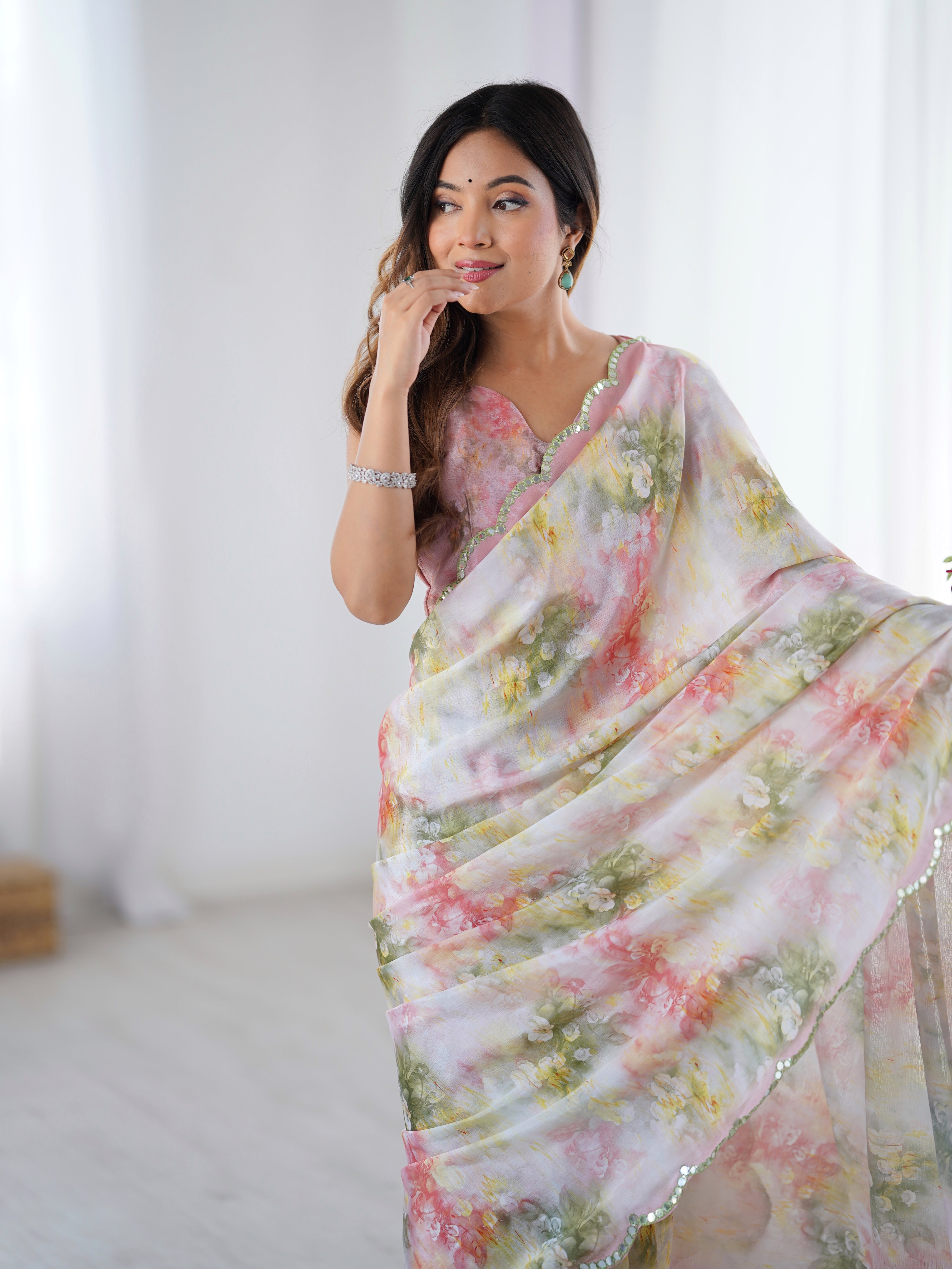 Heavy Chinnon floral print saree with intricate Kutchi work mirror lace border