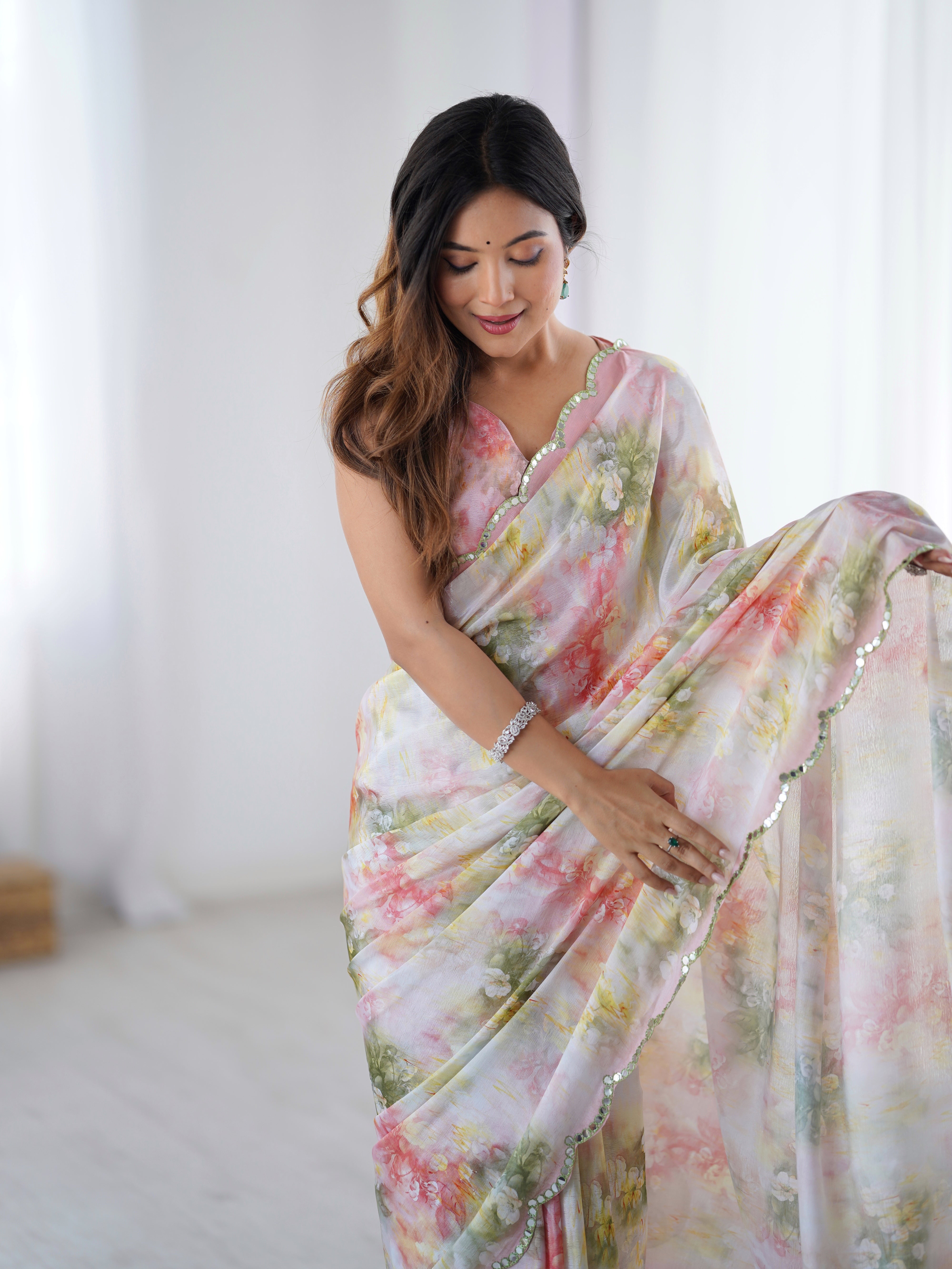 Heavy Chinnon floral print saree with intricate Kutchi work mirror lace border