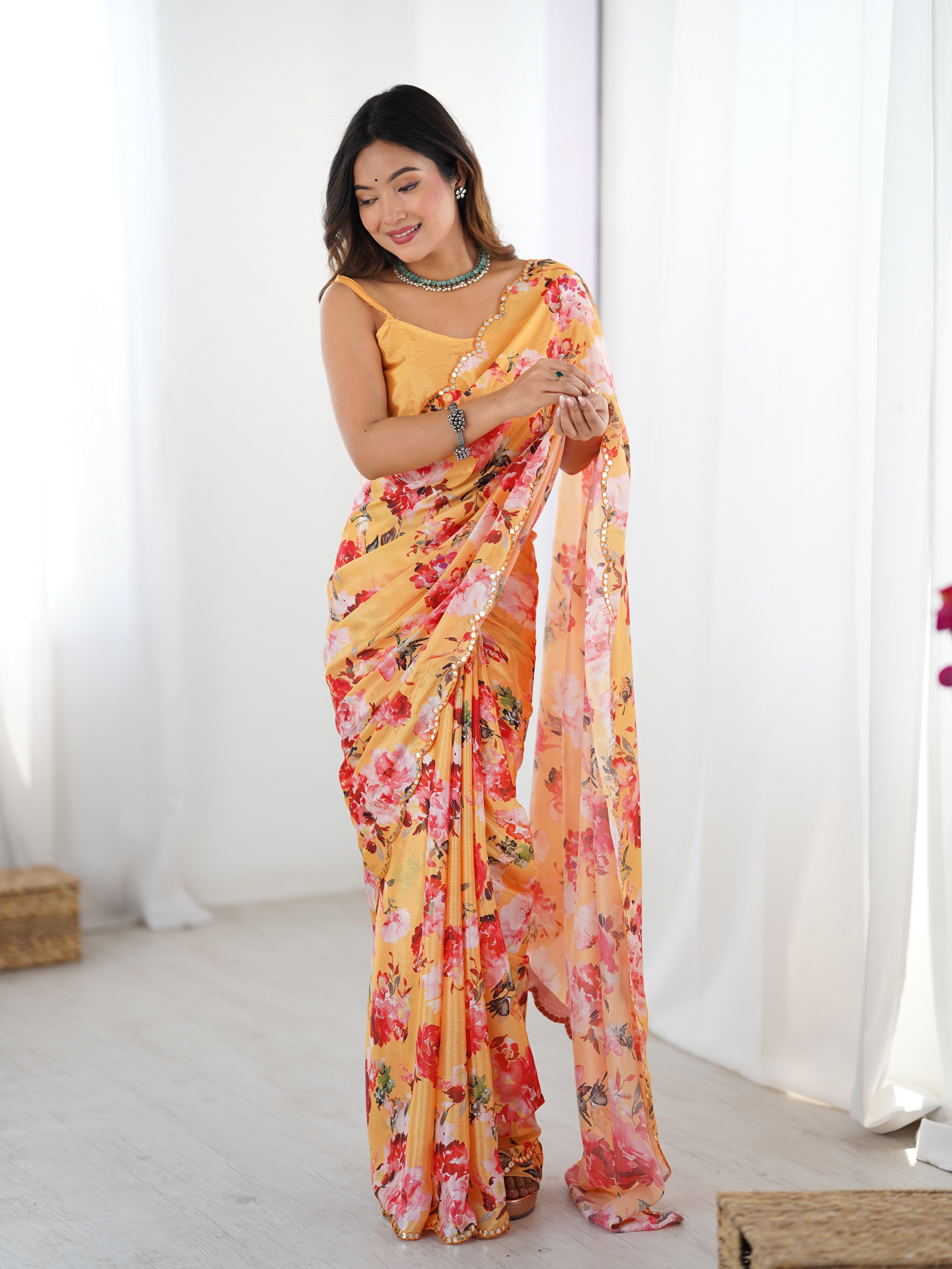 Heavy Chinnon floral saree featuring intricate Kutchi work mirror lace.