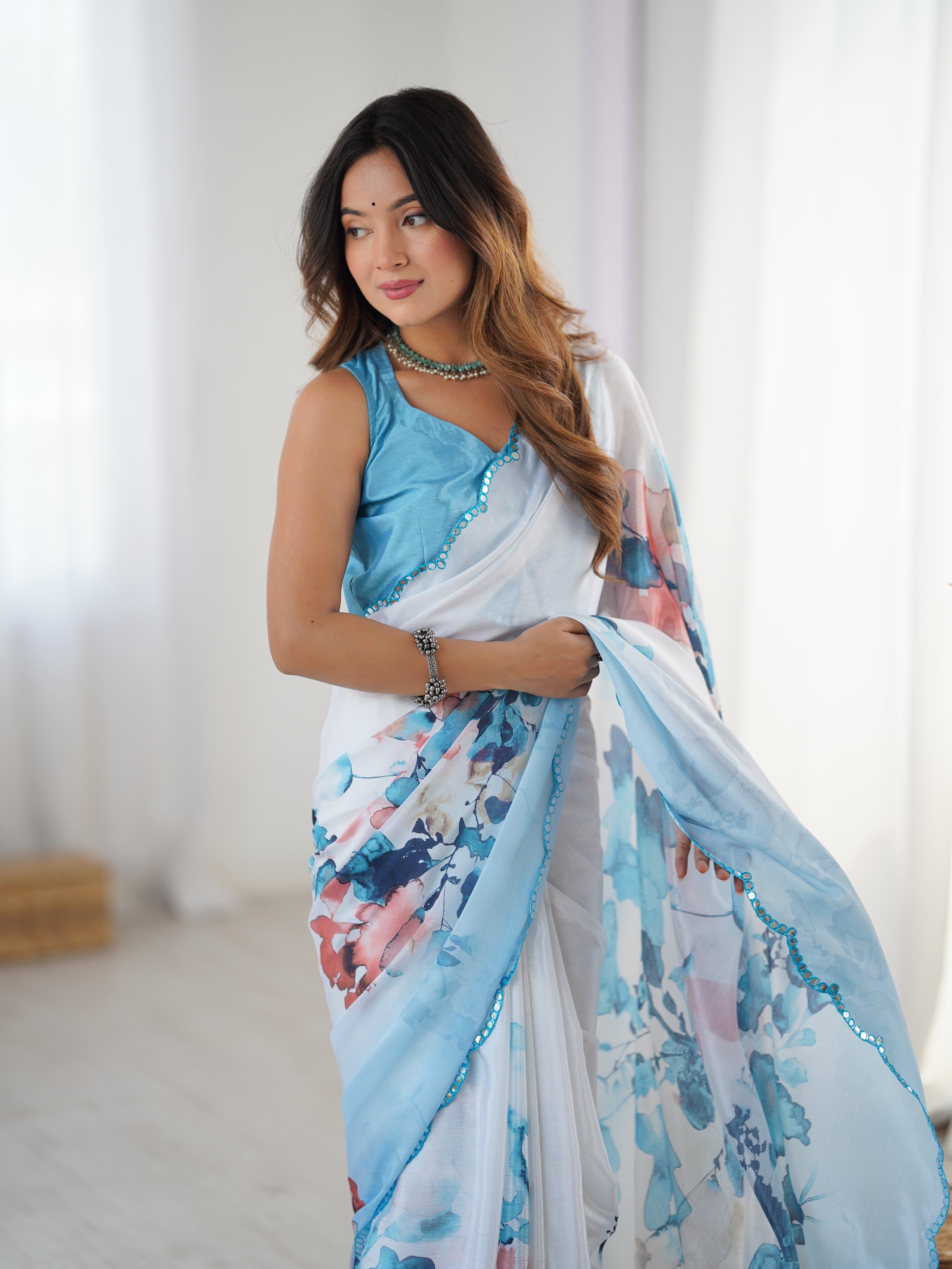 Elegant Chinnon Saree with Kutchi Mirror Lace Border and unstitched blouse, worn by model