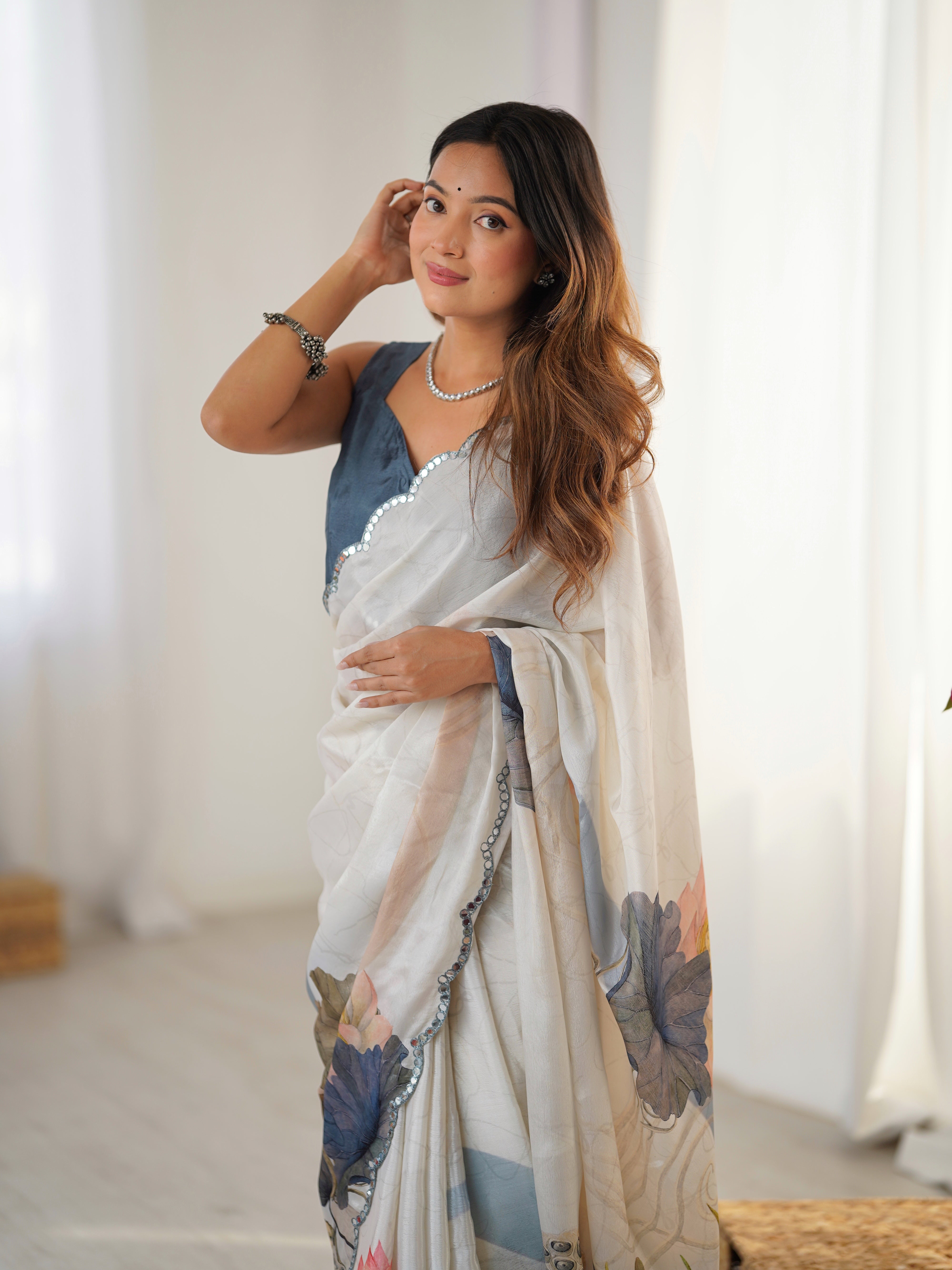 TRENDBUY Heavy Chinnon Saree with elegant lotus print and dazzling Kutchi mirror lace border