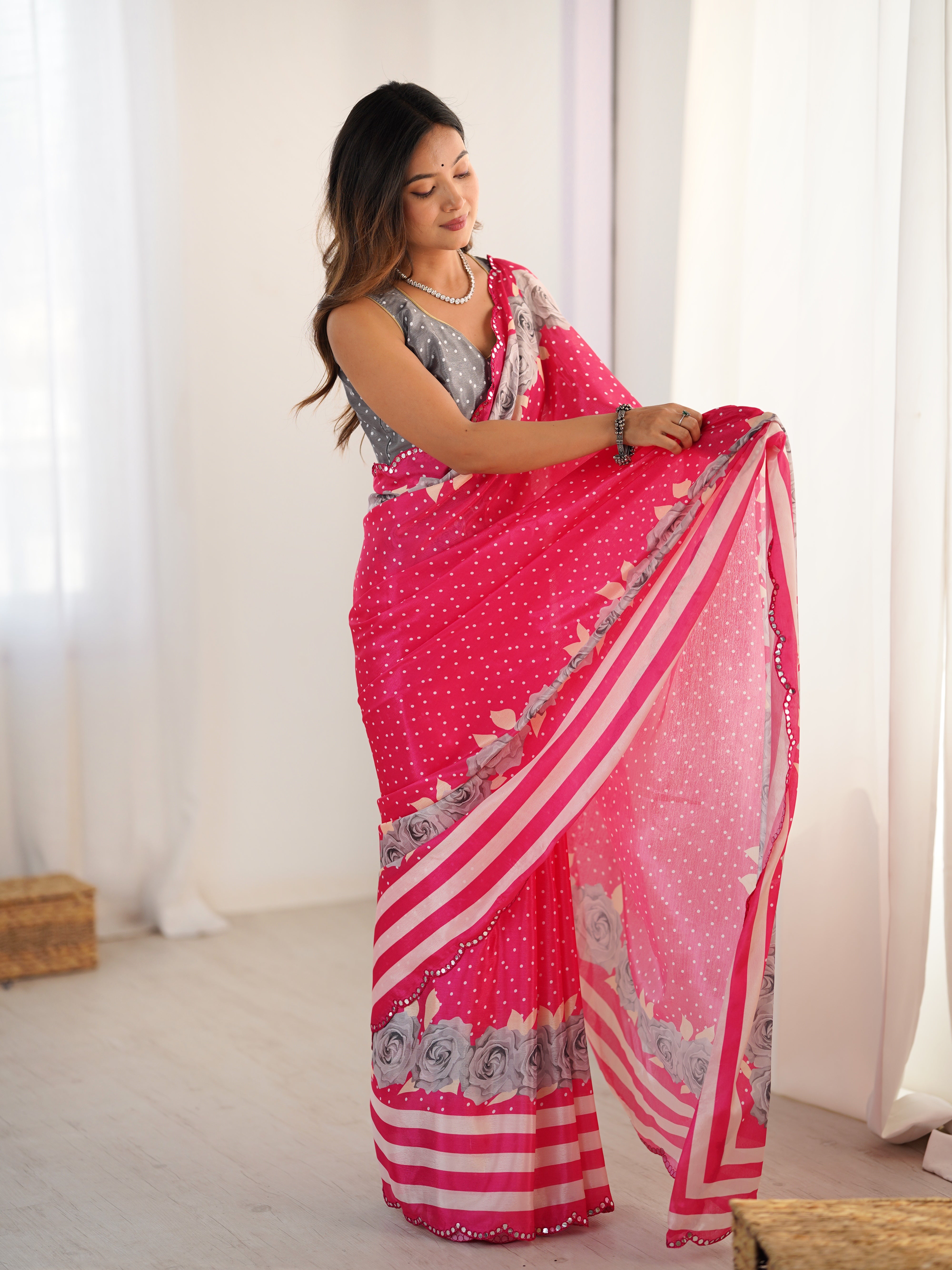 Pink Chinnon saree featuring elegant Kutchi mirror work lace border detail.